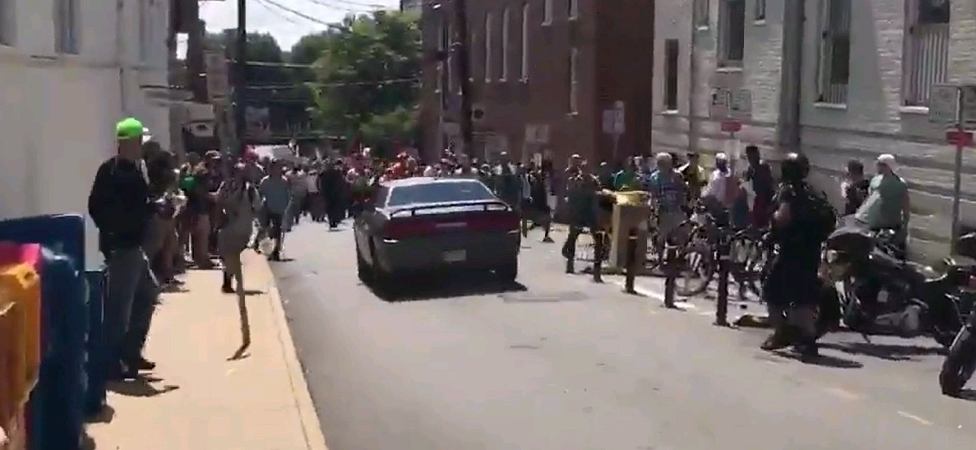 epa06140859 A video grab made available by Brennan Gilmore? shows a car hitting a crowd in Charlottesville, Virginia, USA, 12 August 2017. According to media reports at least one person was killed after a car hit a crowd of people counter-protesting the 'Unite the Right' rally which was scheduled to take place in Charlottesville on 12 August.  EPA/BRENNAN GILMORE / HANDOUT  HANDOUT EDITORIAL USE ONLY/NO SALES