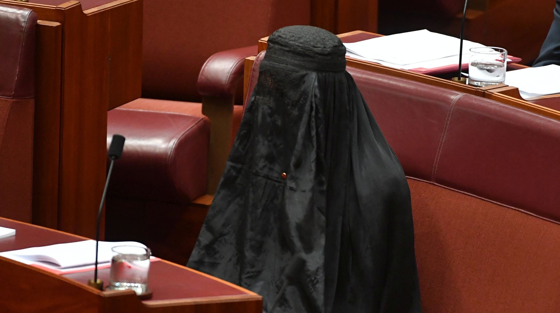 epa06147924 One Nation Leader Senator Pauline Hanson wears a full Islamic burqa veil in the Senate chamber at Parliament House in Canberra, Australian Capital Territory, Australia, 17 August 2017. Hanson attended Senate Question Time wearing a full burqa and she is expected to deliver later in the day a speech calling for the banning on full face coverings in public, media reported. Her identified was checked before entering the red chamber, media added.  EPA/MICK TSIKAS  AUSTRALIA AND NEW ZEALAND OUT