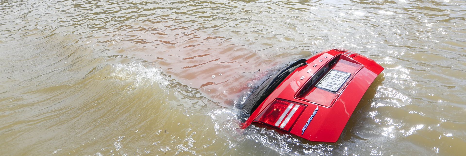 epa06172394 An automobile sits submerged in rising floodwaters from Buffalo Bayou in the aftermath of Hurricane Harvey in Houston, Texas, USA, 30 August 2017. Hurricane Harvey made landfall on the south coast of Texas as a major hurricane category 4. The last time a major hurricane of this size hit the United States was in 2005.  EPA/TANNEN MAURY