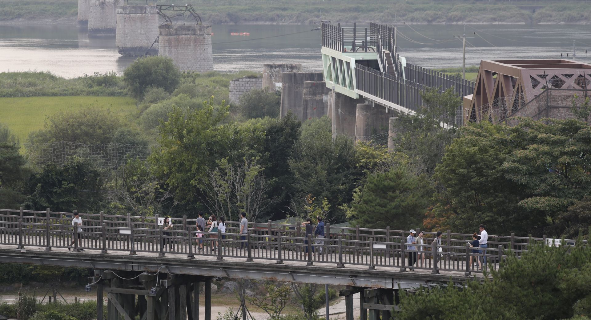 epa06180710 Visitors walk on the freedom bridge symbolizing the division of Korea into North and South on Imjingak near the Demilitarized Zone (DMZ) in Paju, Gyeonggi-do, South Korea, 09 August 2017.  Reports state that North Korea is believed to have conducted its sixth nuclear test.  EPA/JEON HEON-KYUN