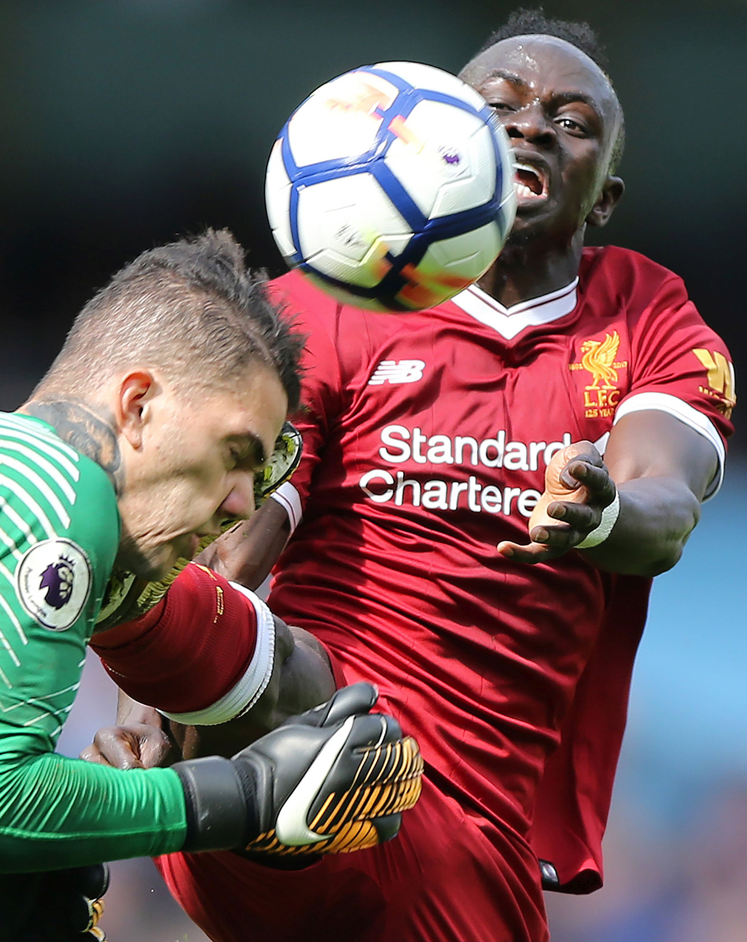 epa06193885 Manchester City's goalkeeper Ederson Santana de Moraes (L) is fouled by Liverpool's Sadio Mane during the English Premier League soccer match between Manchester City and Liverpool FC at the Etihad Stadium in Manchester, Britain, 09 September 2017.  EPA/NIGEL RODDIS EDITORIAL USE ONLY. No use with unauthorised audio, video, data, fixture lists, club/league logos 'live' services. Online in-match use limited to 75 images, no video emulation. No use in betting, games or single club/league/player publications.