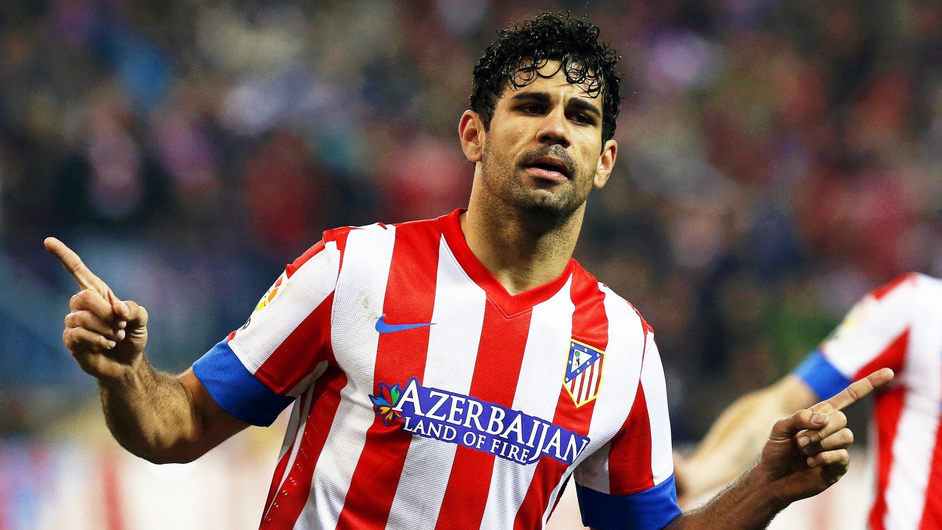 epa06217851 (FILE) - Atletico Madrid's Diego Costa celebrates after scoring during the Spanish King's Cup semi final, first leg soccer match against Sevilla FC at Vicente Calderon stadium in Madrid, Spain, 31 January 2013 (reissued 21 September 2017). English Premier League side Chelsea FC have agreed terms for the transfer of Diego Costa back to Spanish Primera Division side Atletico Madrid, British media reports stated on 21 September 2017.  EPA/JUAN CARLOS HIDALGO *** Local Caption *** 51401199