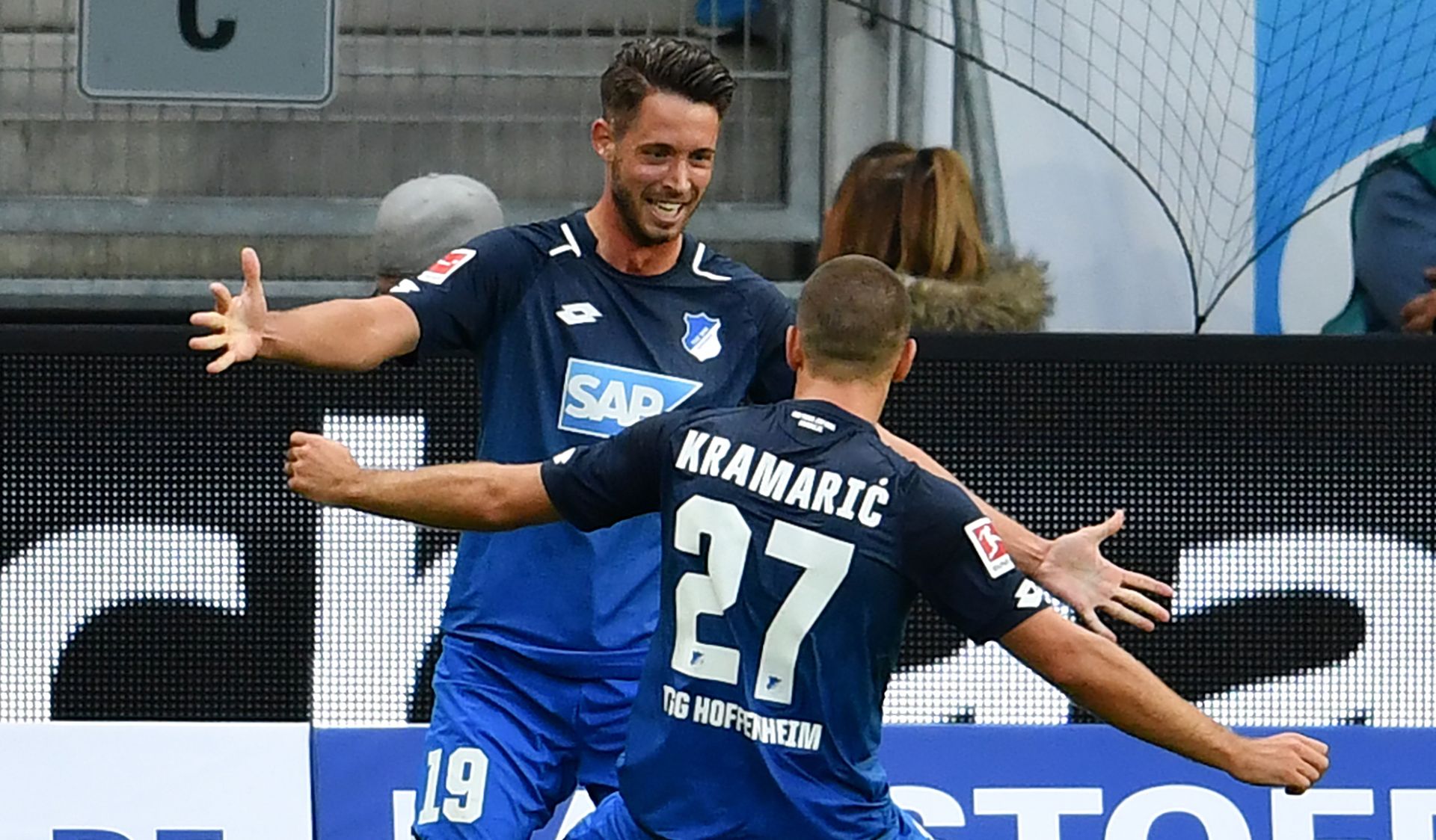 Hoffenheim's Mark Uth (l) celebrates his 1:0 goal with team colleague Andrej Kramaric  during the German Bundesliga soccer match between 1899 Hoffenheim and Bayern Munich at the Rhein-Neckar-Arena in Sinsheim, Germany, 9 September 2017.



(EMBARGO CONDITIONS - ATTENTION: Due to the accreditation guidlines, the DFL only permits the publication and utilisation of up to 15 pictures per match on the internet and in online media during the match.) Photo: Hasan Bratic/dpa
