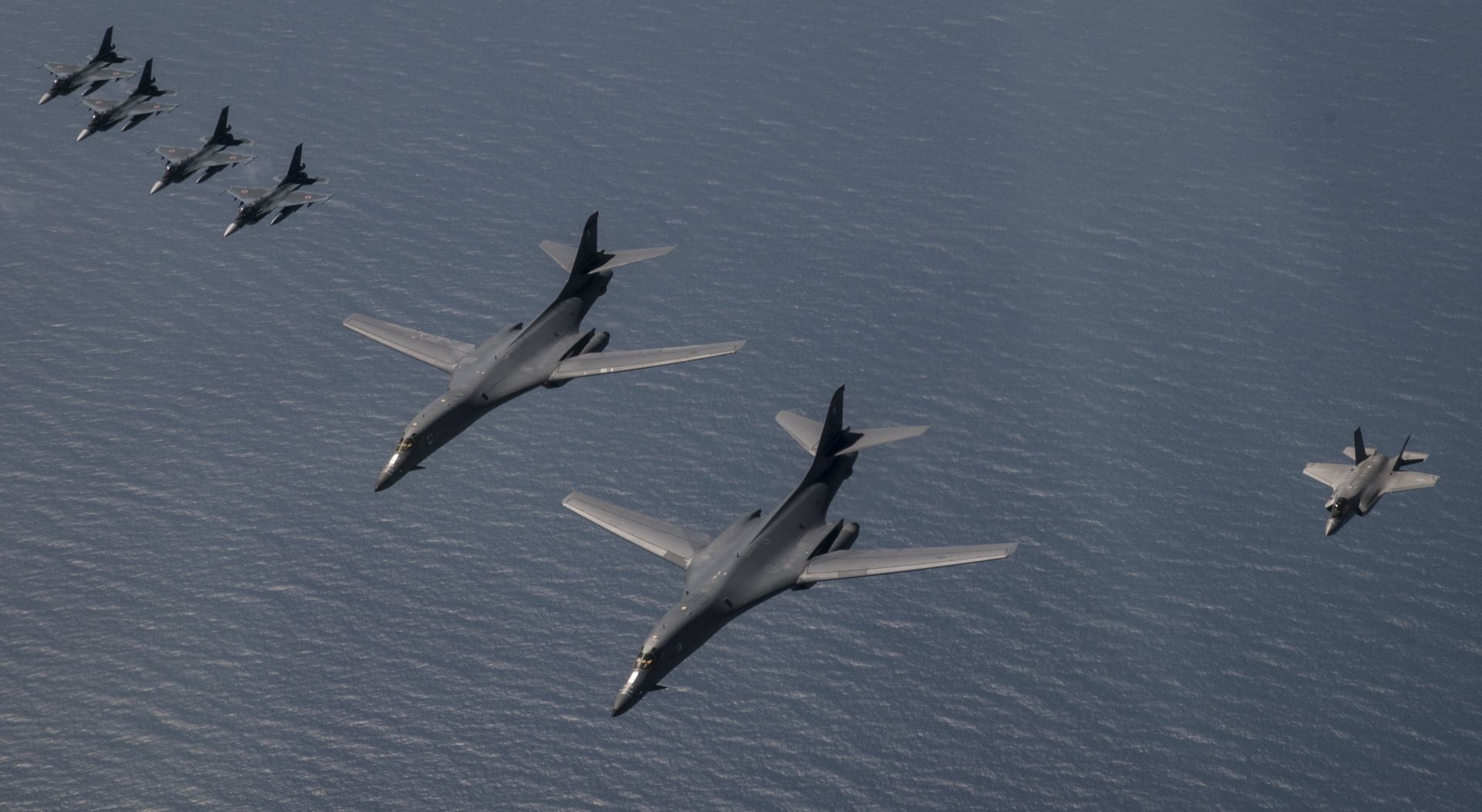 epa06212915 A handout photo made available by the US Air Force on 19 September 2017 shows US Air Force B-1B Lancers, US Marine F-35B Lightning IIs and Japan Air Defense Force F-2s flying in formation during a show of force, north of Japan, 18 September 2017. The flight took place in response to a North Korean test-launch of an intercontinental ballistic missile over the northern Japanese island of Hokkaido on 15 September 2017.  EPA/US AIR FORCE/CAPT. MIKE KARNES HANDOUT  HANDOUT EDITORIAL USE ONLY/NO SALES
