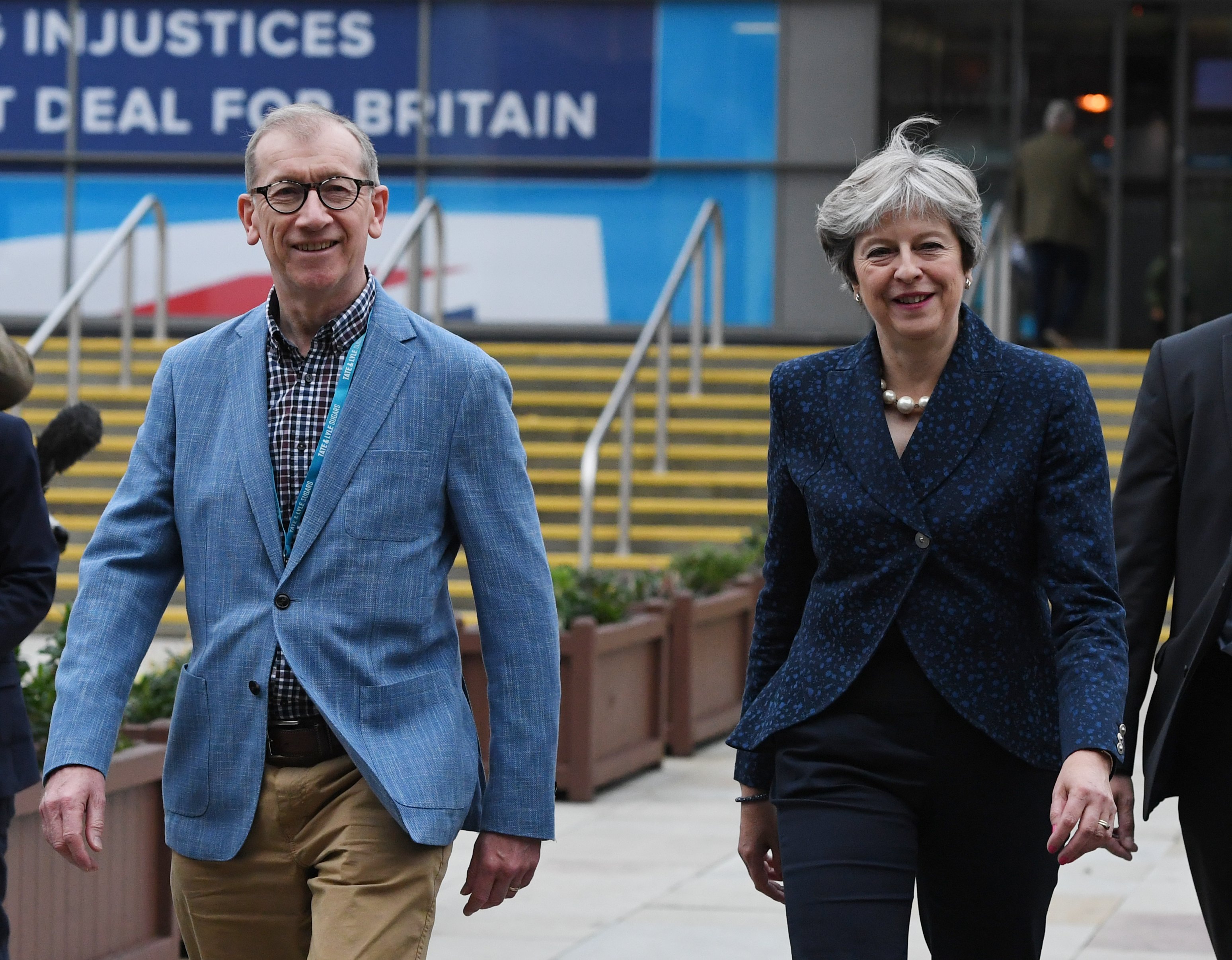 epa06239551 British Prime Minister, Theresa May and her husband Philip walk to their hotel during the second day of Conservative Party Conference in Manchester, Britain, 02 October 2017. The conference will run from 01-04 of October 2017.  EPA/FACUNDO ARRIZABALAGA