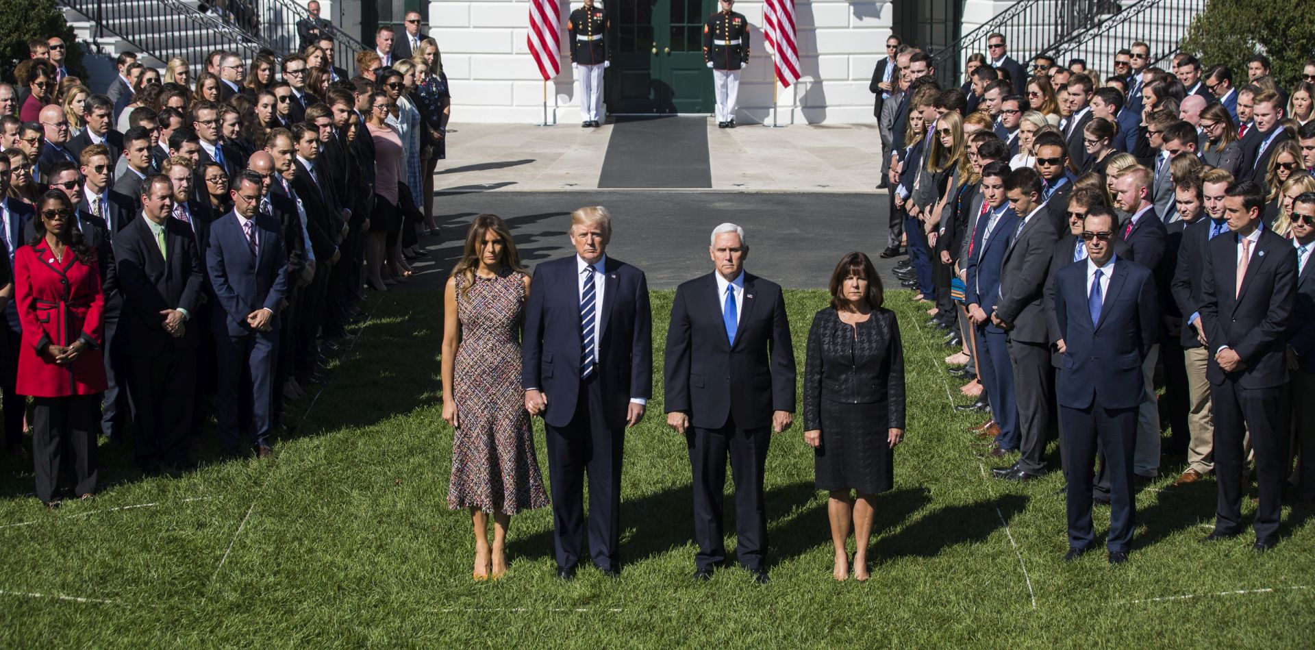 epa06240501 US President Donald J. Trump (C-L) and First Lady Melania Trump (L), along with Vice President Mike Pence (C-R) and and his wife Karen Pence (R), surrounded by staff, hold a moment of silence for the victims of the mass shooting in Las Vegas on the South Portico of the White House in Washington, DC, USA, 02 October 2017. The mass shooting, which left at least 58 people dead and more than 500 injured, is the largest in modern US history  EPA/JIM LO SCALZO