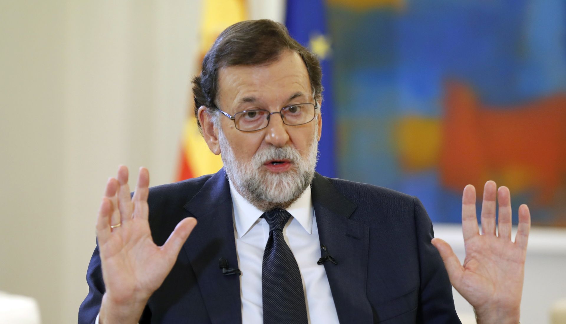 epa06246590 Spanish Prime Minister Mariano Rajoy gestures during an interview with Spanish News Agency Agencia EFE, at La Moncloa Palace in Madrid, Spain, 05 October 2017. Rajoy demanded from Catalonian regional Government President Puigdemont to cancel 'as soon as possible' his project of making an unilateral independence declaration. A vast majority voted 'yes' to a Catalan independence in the referendum held 01 October 2017 that had been banned by the Spanish Constitutional Court and saw national police and civil guards deployed in order to prevent the people from voting.  EPA/Angel Diaz