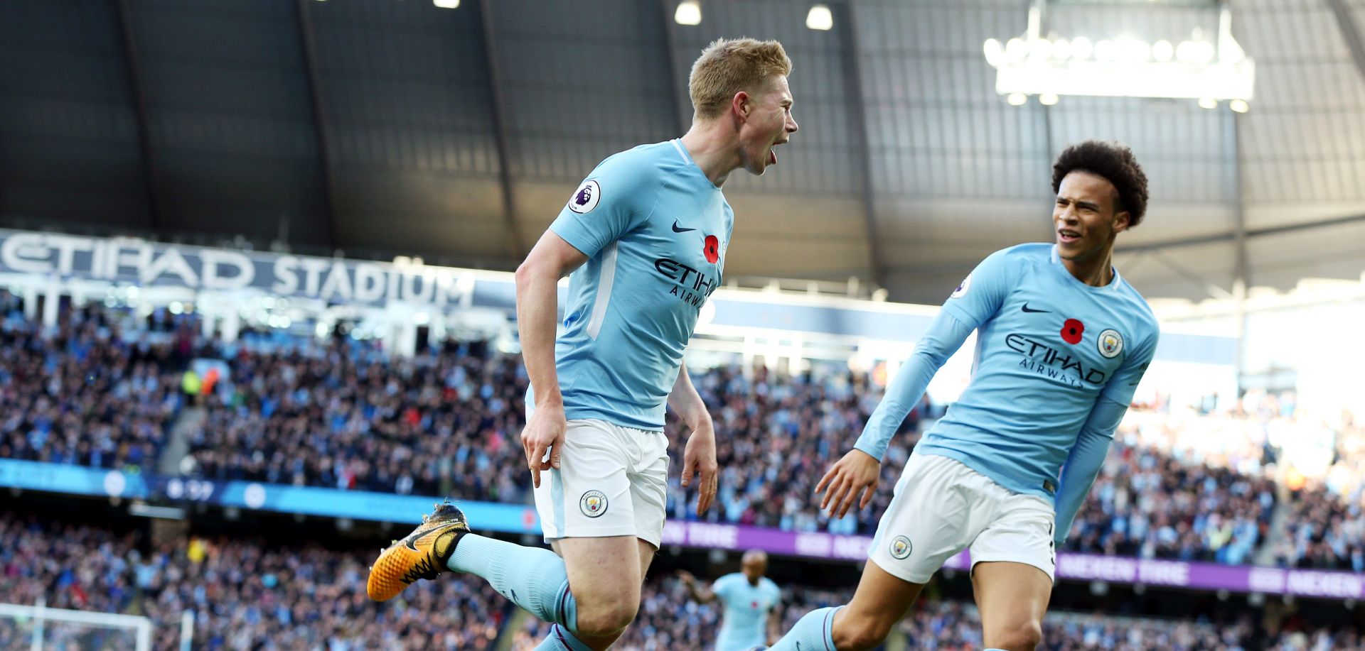 epa06309989 Kevin de Bruyne (L) of Manchester City celebrates with teammate Leroy Sane after scoring the opening goal during the English Premier League match between Manchester City and Arsenal at the Etihad Stadium in Manchester, Britain, 05 November 2017.  EPA/NIGEL RODDIS No use with unauthorised audio, video, data, fixture lists, club/league logos 'live' services. Online in-match use limited to 75 images, no video emulation. No use in betting, games or single club/league/player publications.  EDITORIAL USE ONLY  EDITORIAL  EDITORIAL USE ONLY