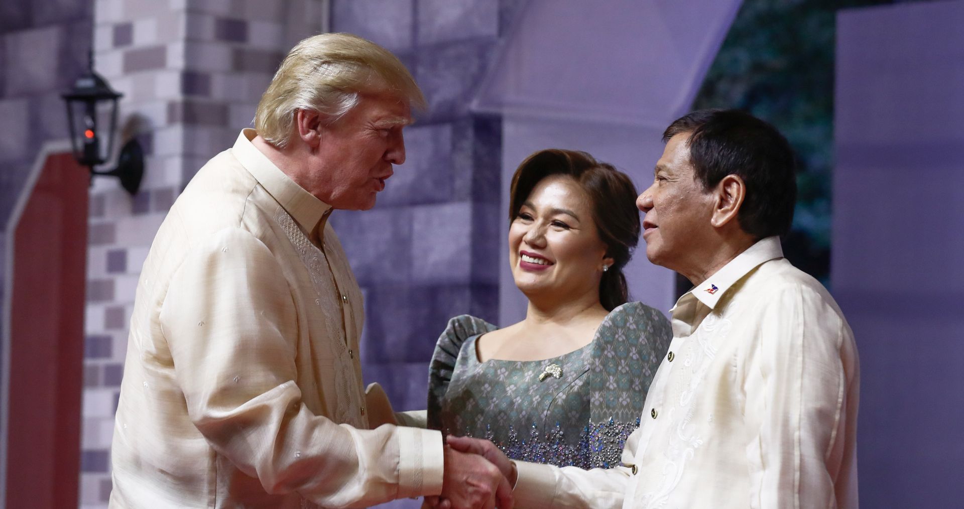 epa06325745 US President Donald J. Trump (L) is greeted by the Philippine President Rodrigo Duterte and Honeylet Avancena, his common-law wife, on arrival for the opening ceremony and gala dinner for the Association of Southeast Asian Nations (ASEAN) Summit in Manila, Philippines, 12 November 2017 (issued 13 November 2017). The Philippines is hosting the 31st ASEAN Summit and Related Meetings from 10 to 14 November.  EPA/ALEX ELLINGHAUSEN / POOL  AUSTRALIA AND NEW ZEALAND OUT