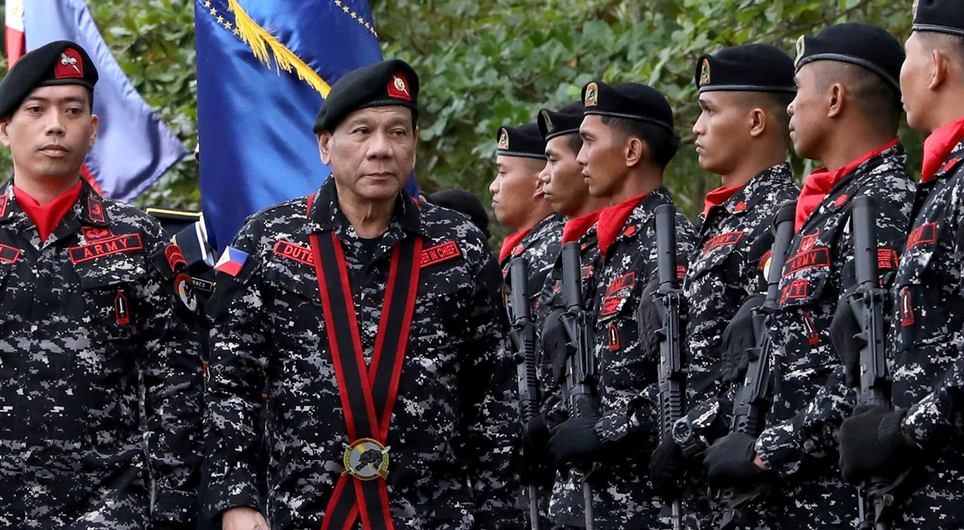 epa06348395 A handout photo made available by the Presidential Photographers Division (PPD) shows Philippine President Rodrigo Duterte (2-L) reviewing honor guards during the 67th anniversary of the First Scout Ranger Regiment (FSRR) at a military camp in San Miguel, Bulacan province, Philippines, 24 November 2017. On November 23, Duterte signed Proclamation Number 360 formally terminating peace talks with the communist block, the National Democratic Front (NDF), following continued attacks by its armed wing, the New Peoples Army (NPA), on government troops.  EPA/ALFRED FRIAS HANDOUT  HANDOUT EDITORIAL USE ONLY/NO SALES