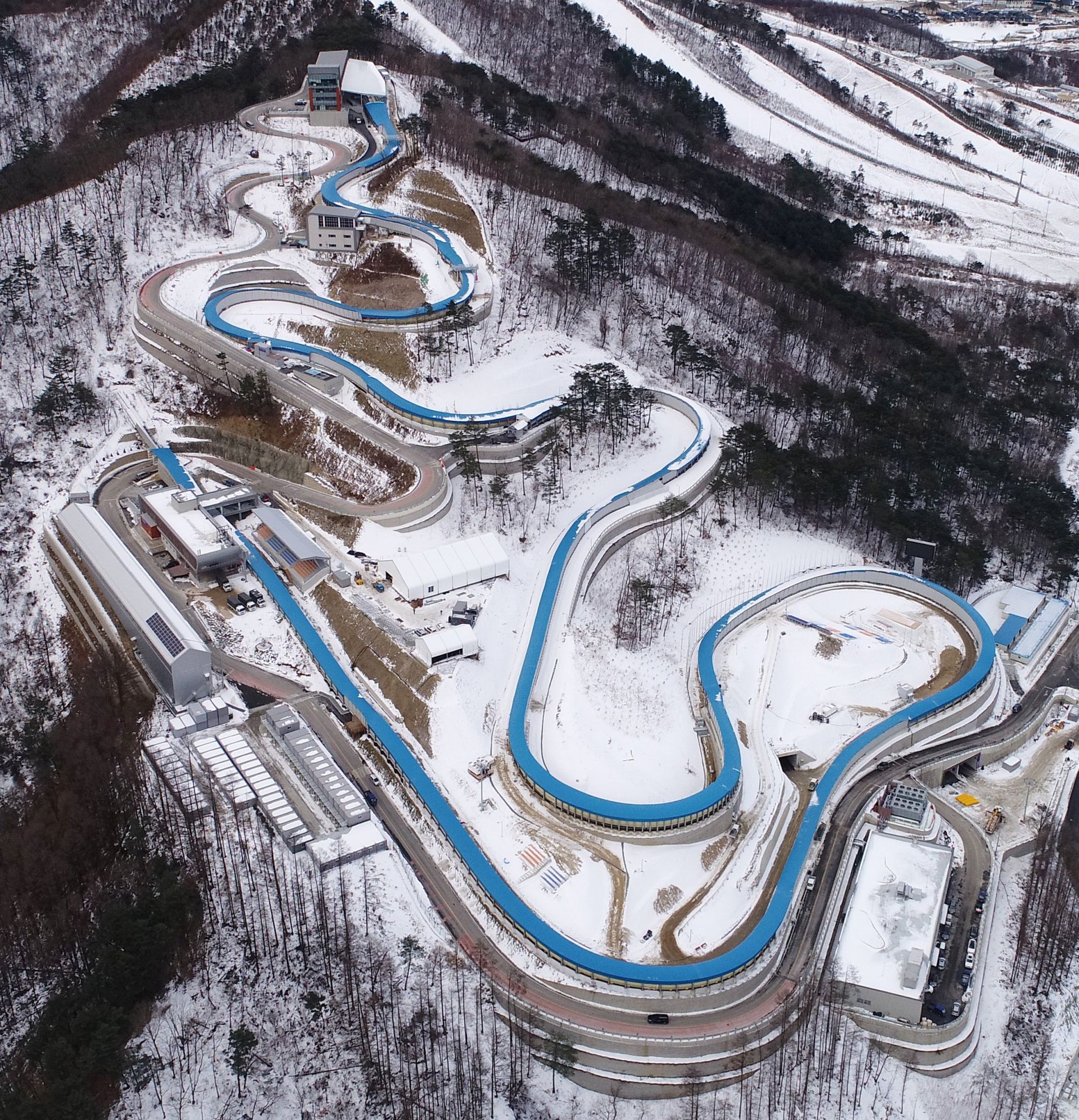 epa06391096 An aerial view shows the sliding center for the 2018 PyeongChang Winter Olympics, east of Seoul, South Korea, 15 December 2017. The venue will host the bobsled, skeleton and luge competitions during the 17-day Winter Games, during which more than 100 gold medals will be awarded in 15 sports.  EPA/YONHAP SOUTH KOREA OUT