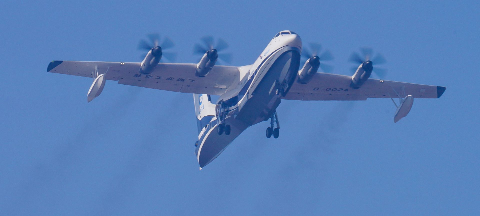 epa06404481 An AG600 amphibious aircraft takes off for its first test flight in Zhuhai, Guangdong province, China, 24 December 2017. The large amphibious flying boat, also known as TA-600, designed and built in China by the Aviation Industry Corporation of China (AVIC), is capable of aerial firefighting by dropping 12 tons of water and of search and rescue operations for 50 passengers.  EPA/KALY SILVA CHINA OUT
