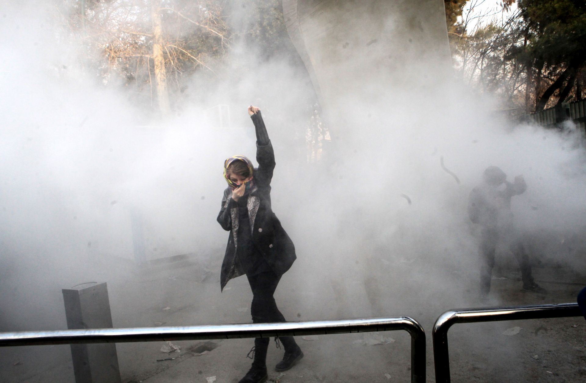 epa06410380 Iranian students clash with riot police during an anti-government protest around the University of Tehran, Iran, 30 December 2017. Media reported that illegal protest against the government is going on in most of the cities in Iran. Protests were held in at least nine cities, including Tehran, against the economic and foreign policy of President Hassan Rouhani's government.  EPA/STR