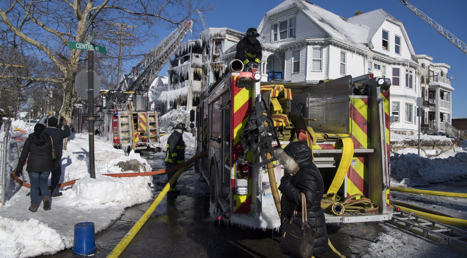 epa06423225 An overnight 5 alarm fire in the Dorchester neighborhood was fought in icy cold temperatures and high winds,  Boston, Massachusetts, USA 07 January 2018. The building is encased in ice after firefighters spent the night battling the blaze that left 25 residents displaced.  EPA/JOHN CETRINO