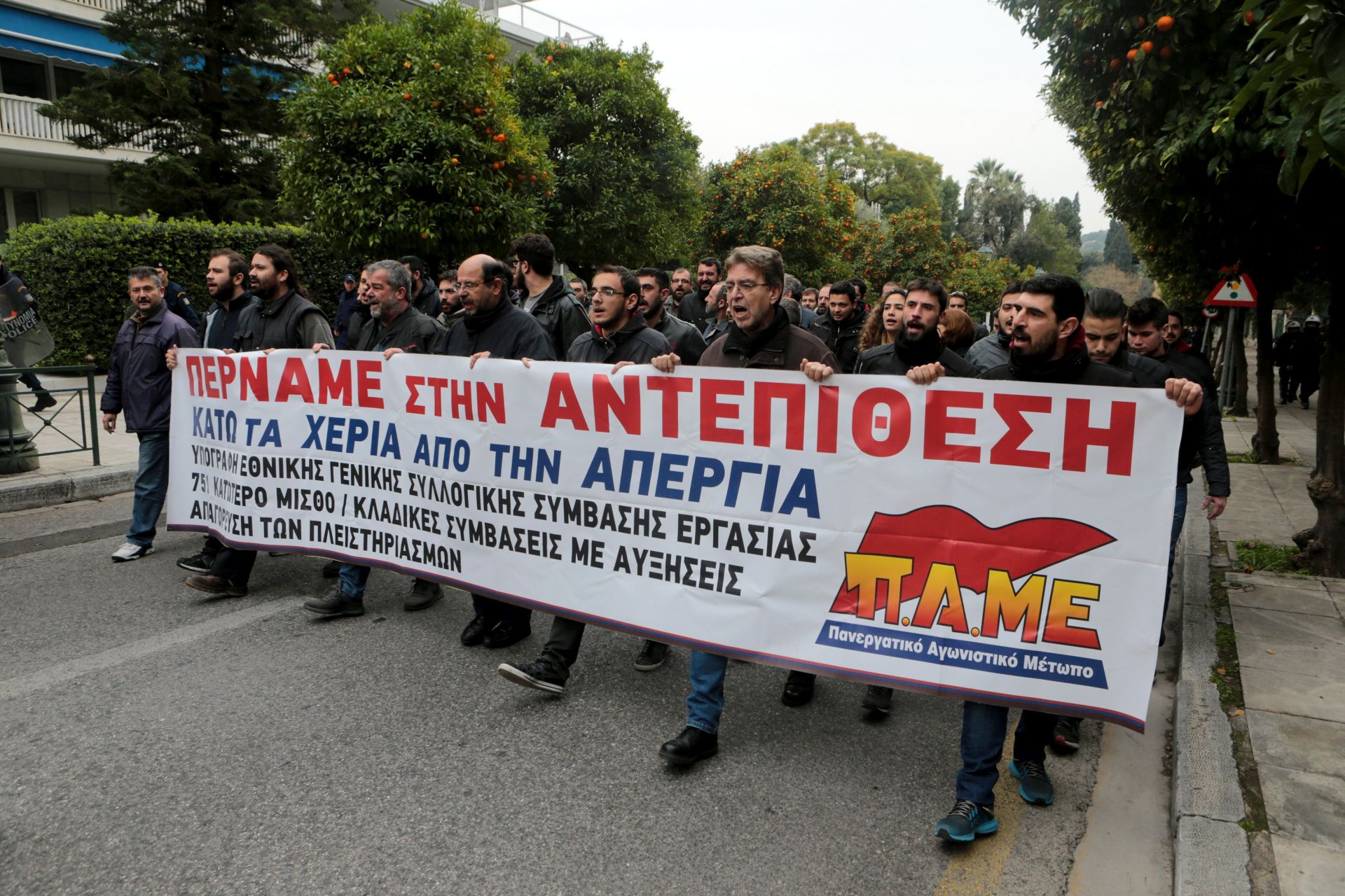 epa06428625 Members of Greek labour unions collaborating with PAME, the Communist Party-affiliated union, shout slogans during a protest at Maximos Mansion, the Greek Prime Minister's seat, n Athens, Greece, 10 January 2018, demanding the government to withdraw their draft omnibus bill that they fear 'limits the right to strike and increases home foreclosures'.  EPA/PANTELIS SAITAS