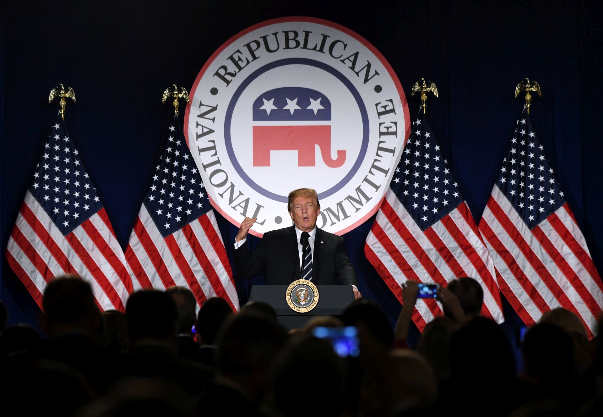epa06490869 US President Donald J. Trump delivers remarks at the Republican National Committee winter meeting at the Trump International Hotel, in Washington, DC, USA, 01 February 2018.  EPA/OLIVIER DOULIERY / POOL