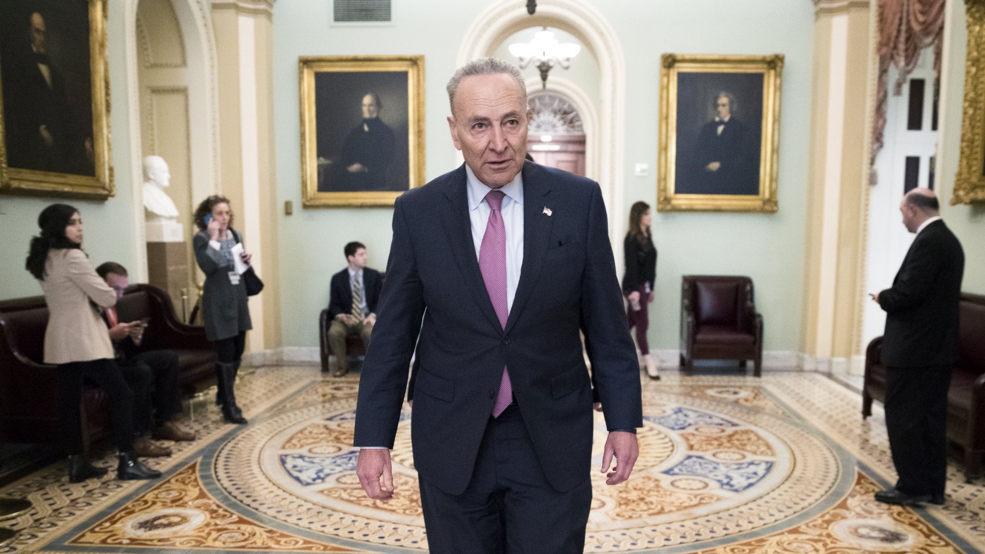 epa06506242 Senate Minority Leader Chuck Schumer walks through the Ohio Clock Corridor just off the Senate floor as negotiations continue in the US Capitol in Washington, DC, USA, 08 February 2018. The Senate will vote today on 6 week continuing resolution that will then go to the House for their up or down vote with a government shutdown in the balance.  EPA/SHAWN THEW