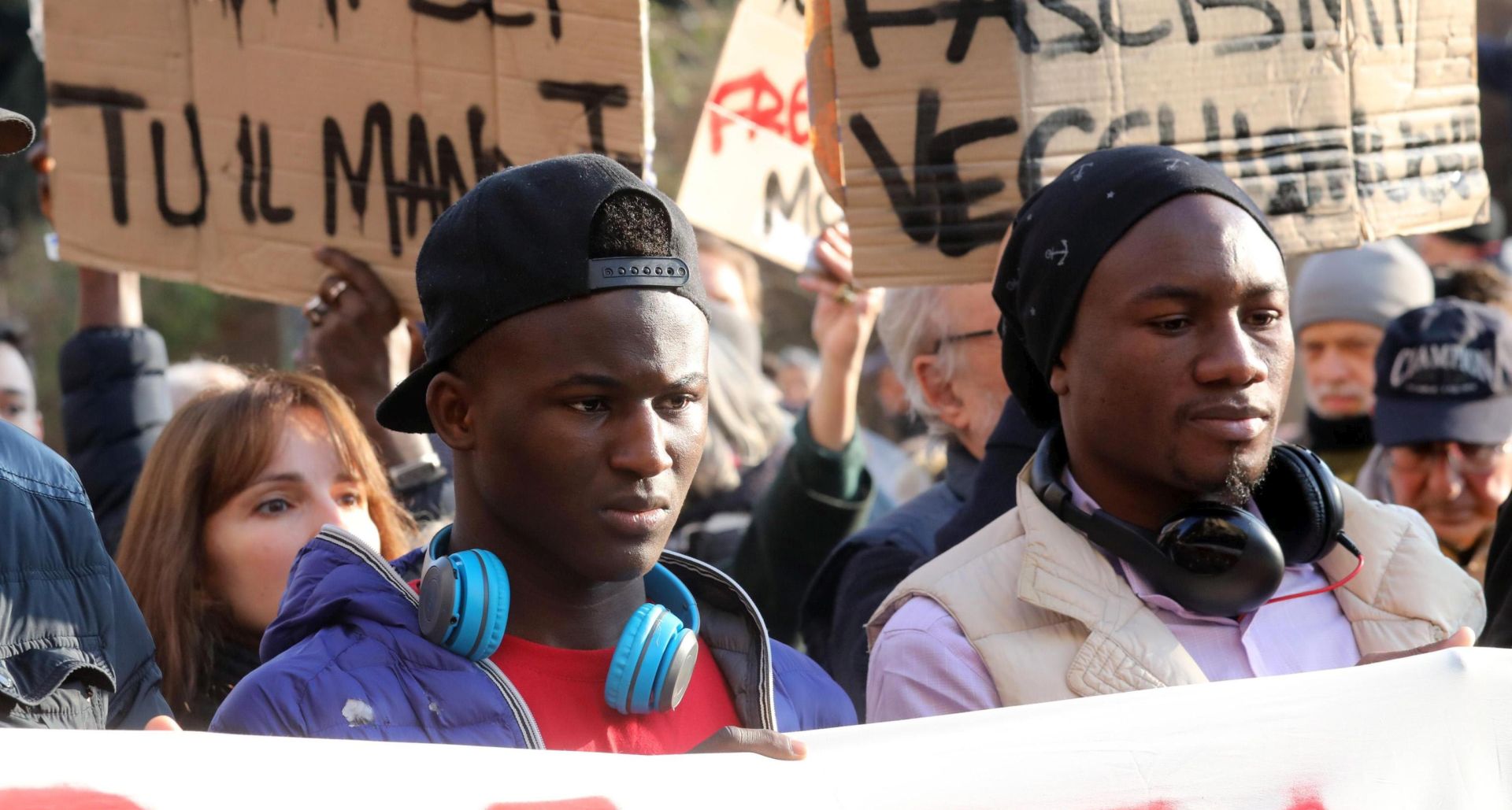 epa06512084 Demonstrators march during an anti-racism rally in Milan, Italy, 10 February 2018. The protest is organised in response to the attack by an Italian nationalist Luca Traini who has confessed to opening fire on African migrants in the central city of Macerata, injuring several people, in an attack that appeared to be racially motivated.  EPA/MATTEO BAZZI