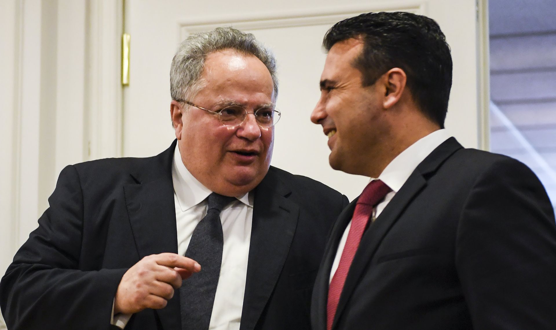 epa06623370 Greek Foreign Minister Nikos Kotzias (L) chats with Macedonian Prime Minister Zoran Zaev (R) after their meeting in Skopje, the Former Yugoslav Republic of Macedonia (FYROM), 23 March 2018. Nikos Kotzias arrived for a two-day official visit to Skopje with a proposal to resolve a long-standing name issue between two neighbouring countries.  EPA/GEORGI LICOVSKI
