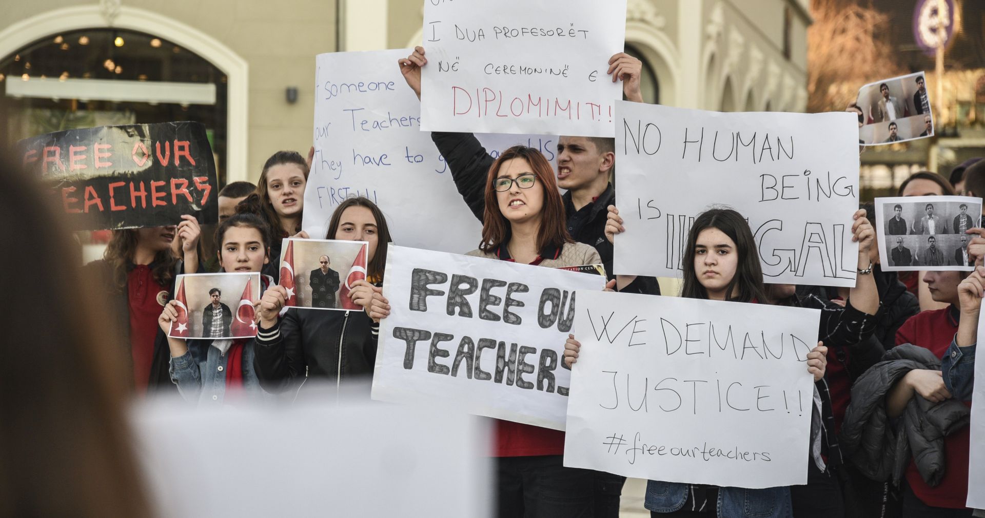 epa06636140 Mehmet Akif College students, holding banners and pictures of their teachers,  protest the arrest and detention of Turkish citizens by Kosovo authorities,  Pristina, Kosovo, 29 March 2018.  EPA/PETRIT PRENAJ