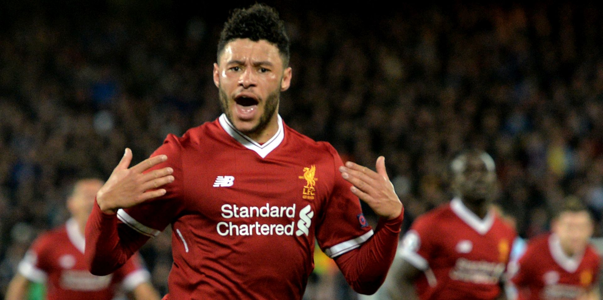 epa06645857 Liverpool's Alex Oxlade-Chamberlain celebrates after scoring the 2-0 lead during the UEFA Champions League quarter final first leg match between FC Liverpool and Manchester City at Anfield Road, Liverpool, Britain, 04 April 2018.  EPA/PETER POWELL
