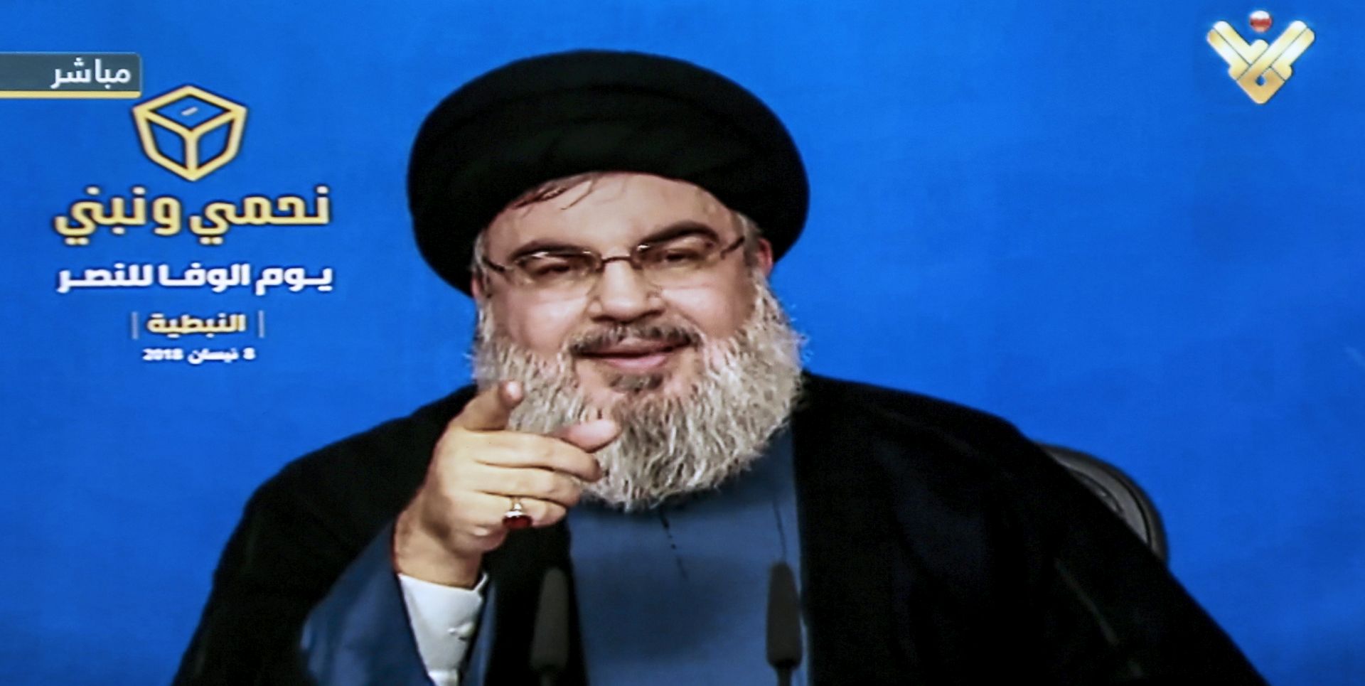 epa06655464 A TV grab from Hezbollah's al-Manar TV shows Hezbollah leader Sayed Hassan Nasrallah giving a televised address from an undisclosed place, during an election rally in Nabatyeh city, southern Lebanon, 08 April  2018. Nasrallah spoke about the treachery and treason against the resistance during the July 2006 war against the Israeli enemy by some politicians and the then government. He also talked about corruption, high cost of living, unemployment, and the public debt that is sweeping the country. He said 'It is the remnants of the political class and successive governments since 1992. The Lebanese should choose the candidates who protect the resistance that defended Lebanon and liberated it from the Israeli occupation, as well as the candidates who carry the project of change in order to save Lebanon'.  EPA/AL-MANAR TV GRAB