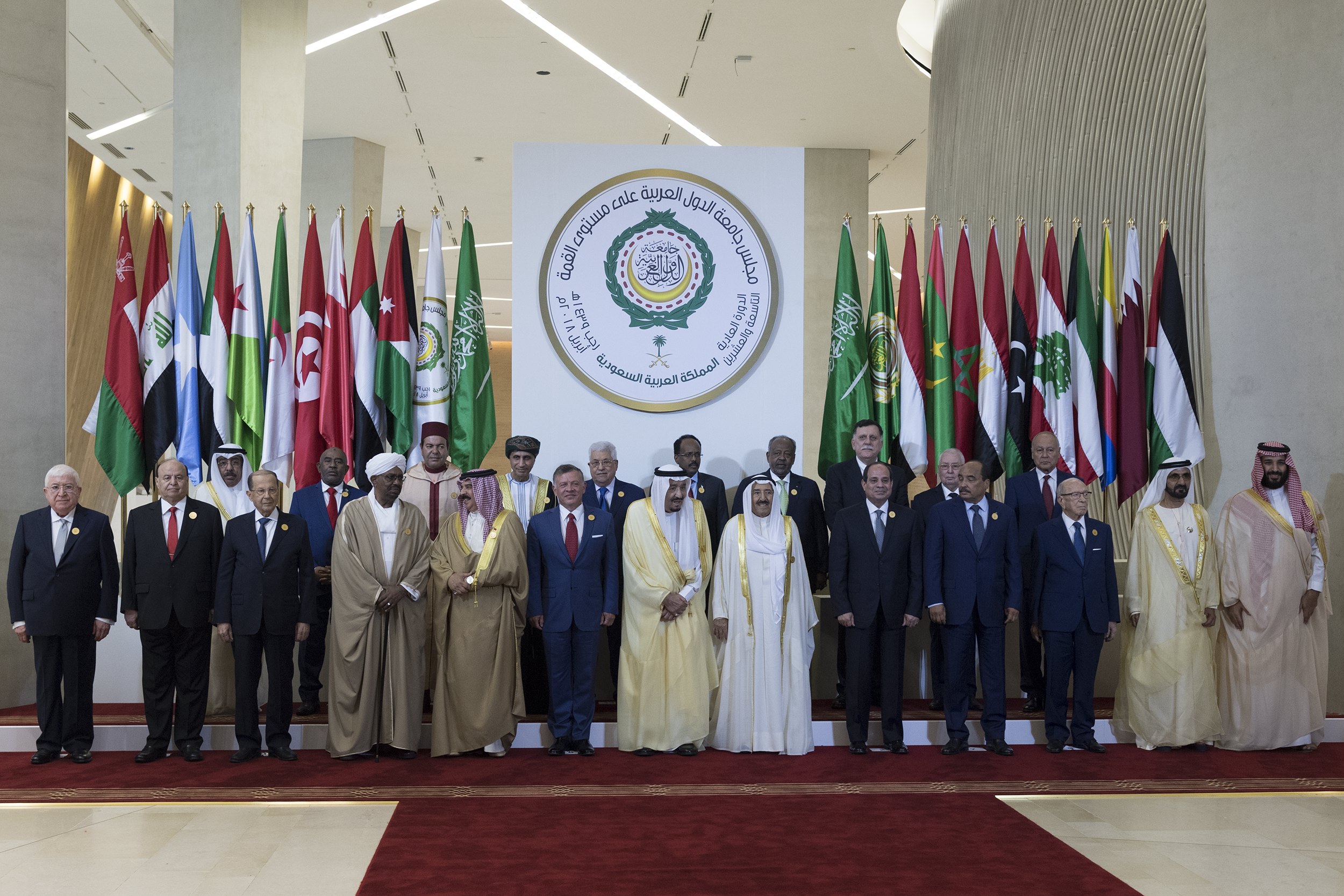 epa06671035 A handout photo made available by the Saudi Press Agency (SPA) shows Saudi King Salman bin Abdulaziz (C) posing for the summit group photo at the 29th Arab Summit, in Dhahran, Saudi Arabia, 15 April 2018. The summit is held one day after the US, France, and Britain launched strikes against Syria on 14 April in response to Syria's suspected chemical weapons attack. Arab leaders are also expected to discuss tension with Iran, Palestinian issue, and developments in Yemen, Lebanon and Libya.  EPA/SAUDI PRESS AGENCY HANDOUT  HANDOUT EDITORIAL USE ONLY/NO SALES