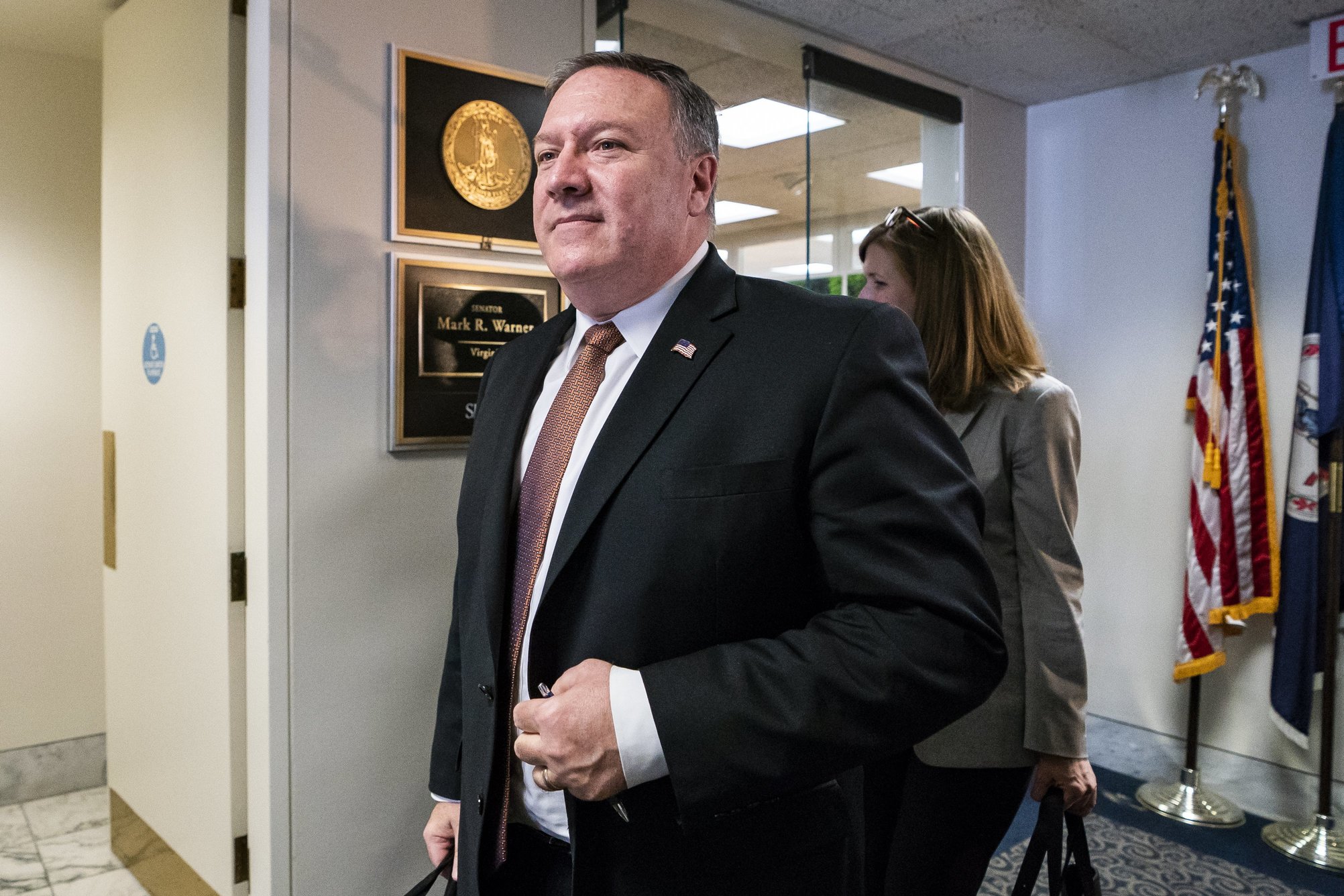 epa06677788 CIA Director Mike Pompeo leaves a meeting with Democratic Senator from Virginia Mark Warner (out of frame) in the Hart Senate Office Building in Washington DC, USA, 18 April 2018. Two weeks ago, Pompeo met secretly with North Korean leader Kim Jong Un in North Korea.  EPA/JIM LO SCALZO