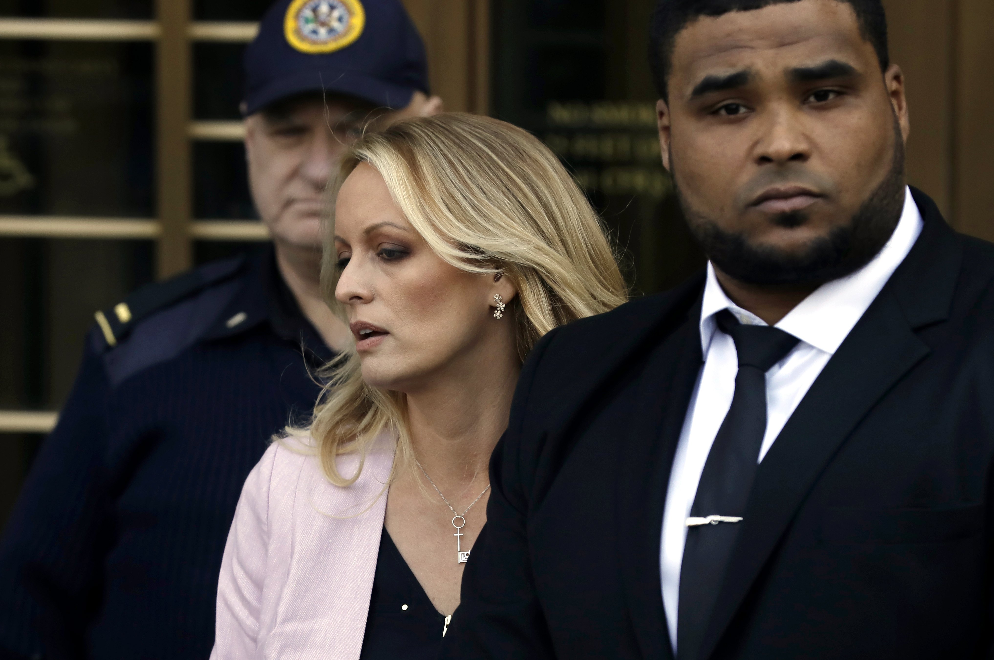 epa06673916 Stormy Daniels (Stephanie Clifford) (C) departs Federal Court after a hearing involving President Donald J. Trump's long-time personal attorney Michael Cohen in New York, New York, USA, 16 April 2018. Cohen's hotel room, apartment and office were raided last week by federal authorities reportedly as part of an investigation into possible bank fraud, wire fraud and campaign finance violations.  EPA/PETER FOLEY