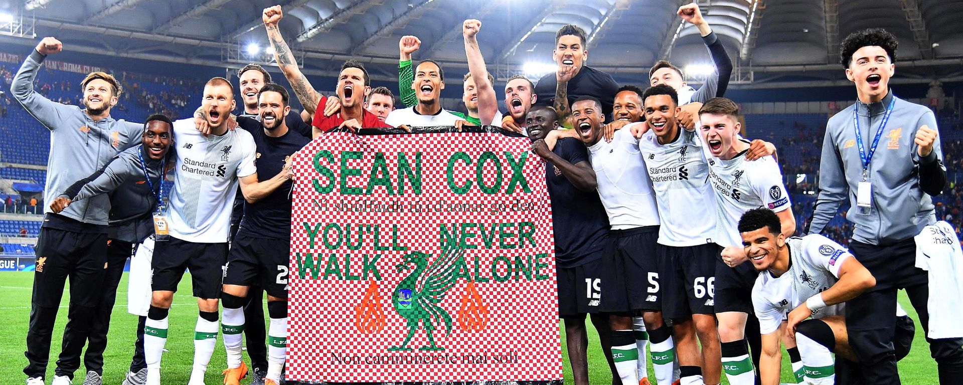 epa06707627 Liverpool players celebrate with a banner supporting Liverpool fan Sean Cox who was severly injured during clashes ahead of the first leg match during the UEFA Champions League semi final, second leg soccer match between AS Roma and Liverpool FC at the Olimpico stadium in Rome, Italy, 02 May 2018. Liverpool won 7-6 on aggregate.  EPA/ETTORE FERRARI