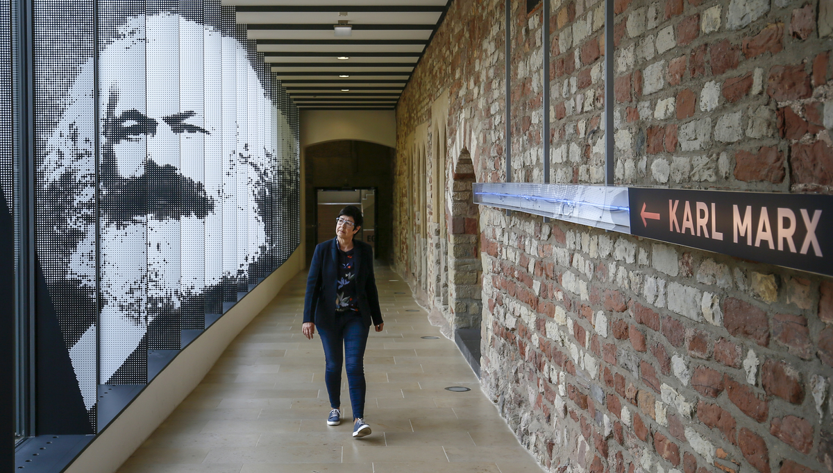 epa06708652 A visitor goes in the city museum Simeonstift at the exhibition 'Karl-Marx 1818-1883 Life. Plant. Time' in Trier, Germany, 03 Mai 2018. The exhibition 'Karl-Marx 1818-1883 Life. Plant. Time' runs from 05 Mai 2018 to 21 October 2018 in Trier.  EPA/RONALD WITTEK
