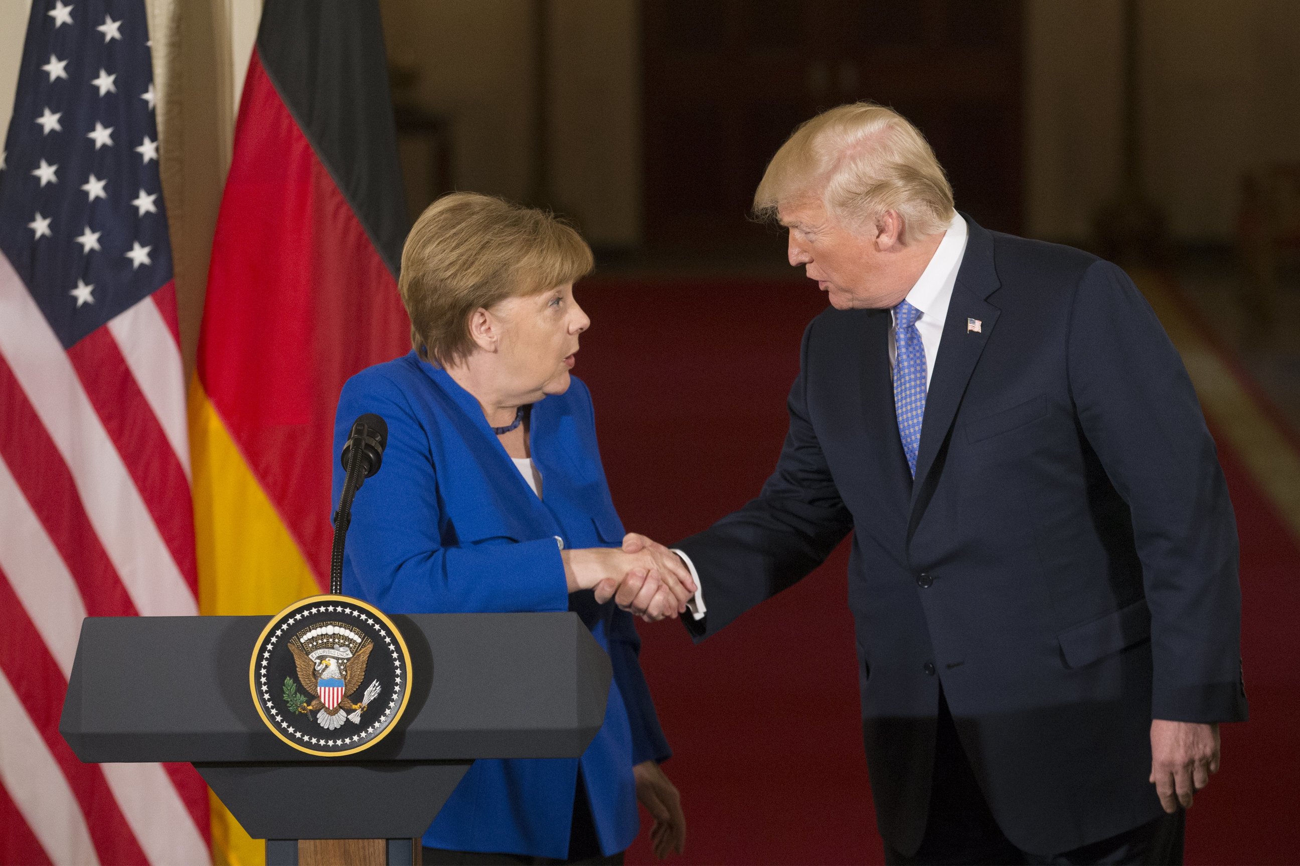 epa06697573 US President Donald J. Trump (R) and Chancellor of Germany Angela Merkel (L) shake hands while holding a joint news conference in the East Room of the White House in Washington, DC, USA, 27 April 2018. Merkel is on a one-day working visit to the White House where she and President Trump were expected to discuss trade issues such as proposed US tariffs on European steel and aluminum products, in addition to topics such as NATO.  EPA/MICHAEL REYNOLDS
