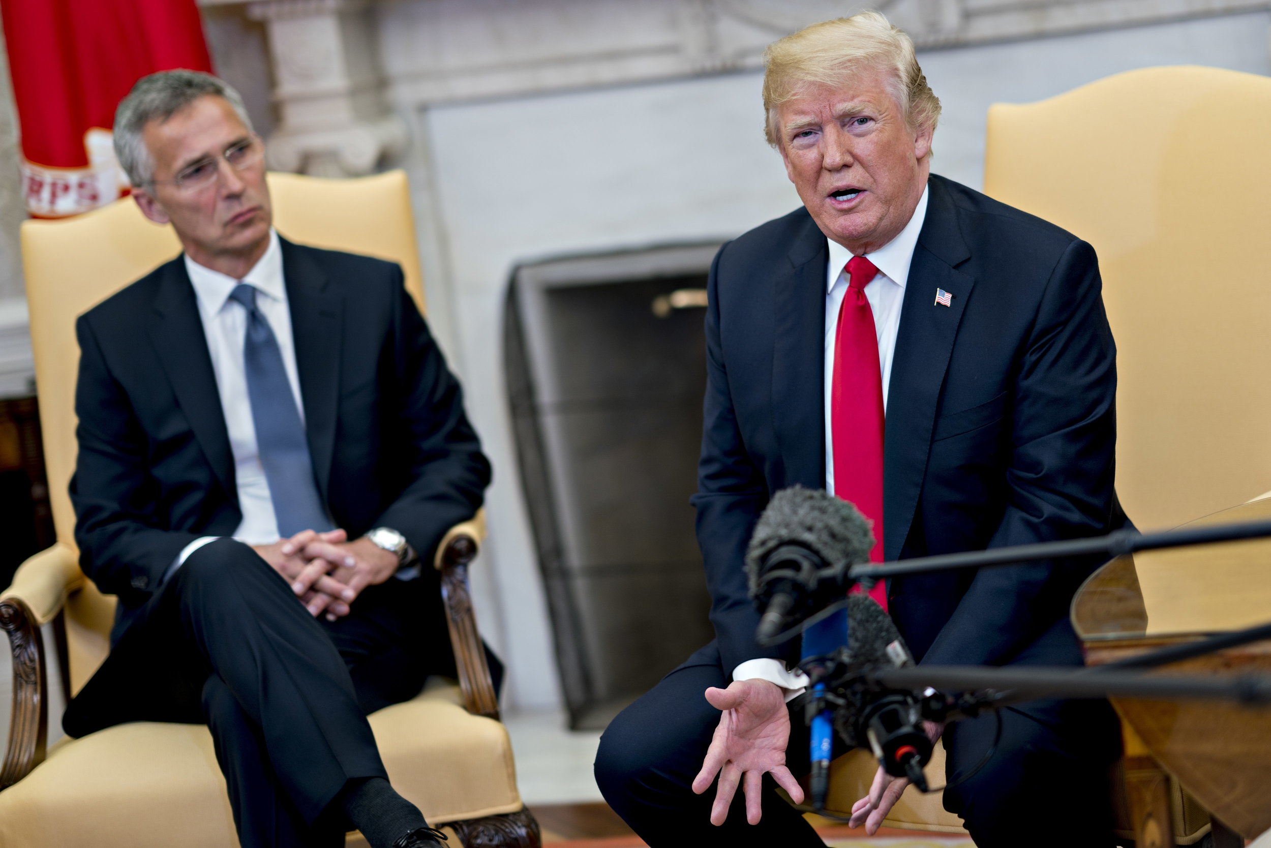 epa06745656 US President Donald J. Trump (R) speaks as Jens Stoltenberg (L), secretary general of the North Atlantic Treaty Organization (NATO), listens during a meeting in the Oval Office of the White House in Washington, DC, USA, 17 May 2018. The White House said the two leaders will be discussing the upcoming NATO Summit in July.  EPA/Andrew Harrer / POOL