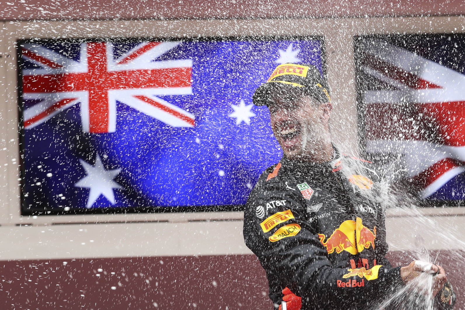 epa06767079 Australian Formula One driver Daniel Ricciardo of Aston Martin Red Bull Racing celebrates on the podium after winning the 2018 Formula One Grand Prix of Monaco at the Monte Carlo circuit in Monaco, 27 May 2018.  EPA/SRDJAN SUKI