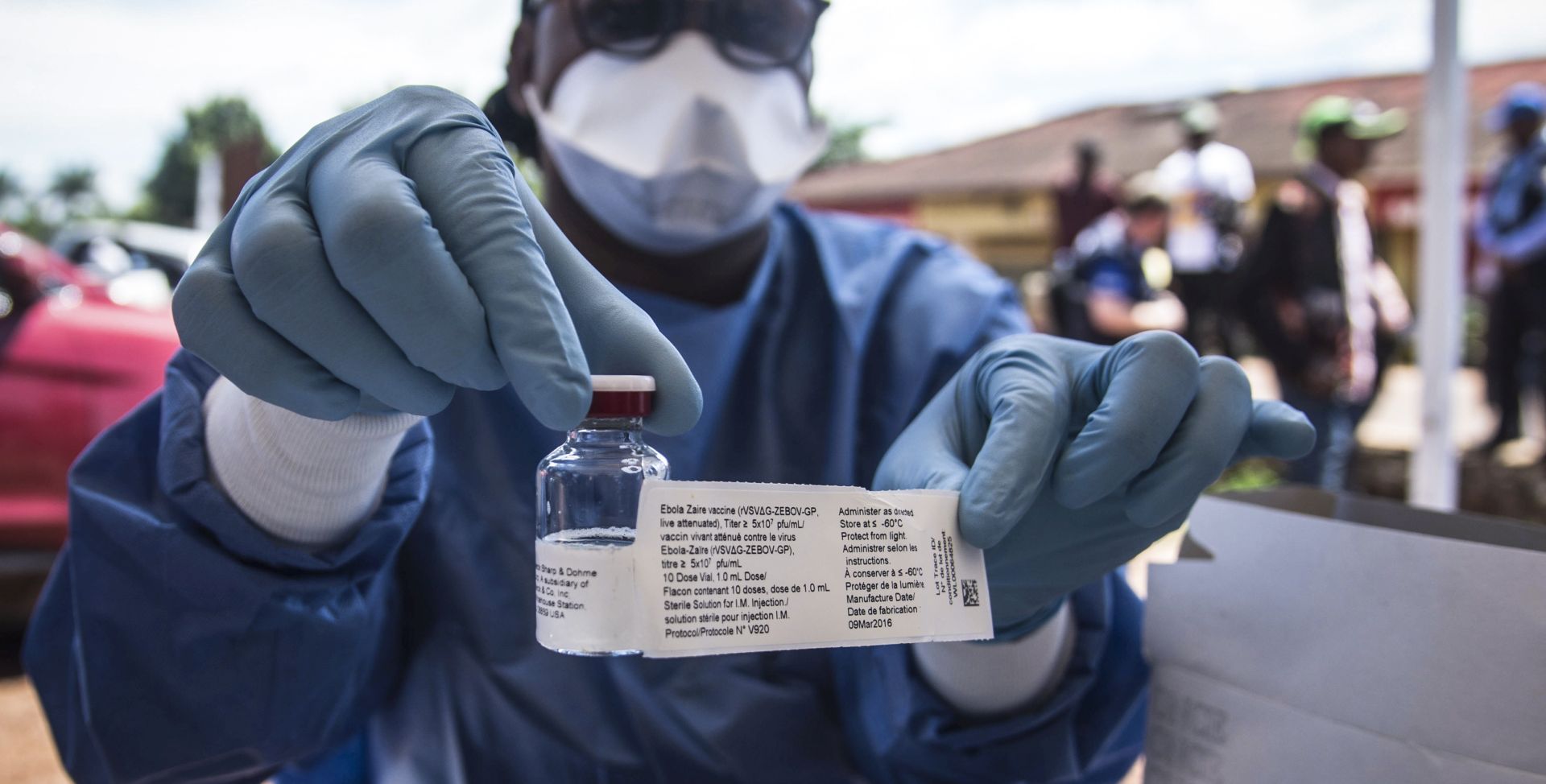 epa06756608 A worker from the World Health Organization (WHO) holds up a vaccination as he prepares to administer it during the launch of an experimental Ebola vaccine in Mbandaka, north-western Democratic Republic of the Congo, 21 May 2018 (issued 22 May 2018). Two more people have died of Ebola, the Congolese authority said on 22 May. One of the deaths occured in Mbandaka, while another died in the village of Bikoro, where the outbreak was first announced in early May. The new outbreak of Ebola has killed 27 people in the  Democratic Republic of the Congo since April.  EPA/STR