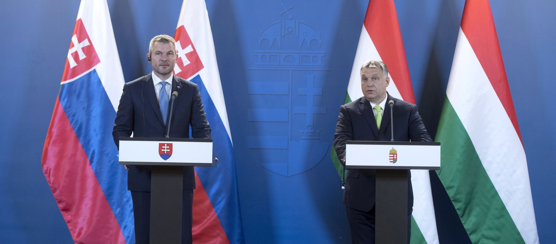 epa06802085 Hungarian Prime Minister Viktor Orban (R) and his Slovakian counterpart Peter Pellegrini  (L) deliver their statements at a joint press conference following their meeting in the parliament building in Budapest, Hungary, 12 June 2018.  EPA/Szilard Koszticsak HUNGARY OUT