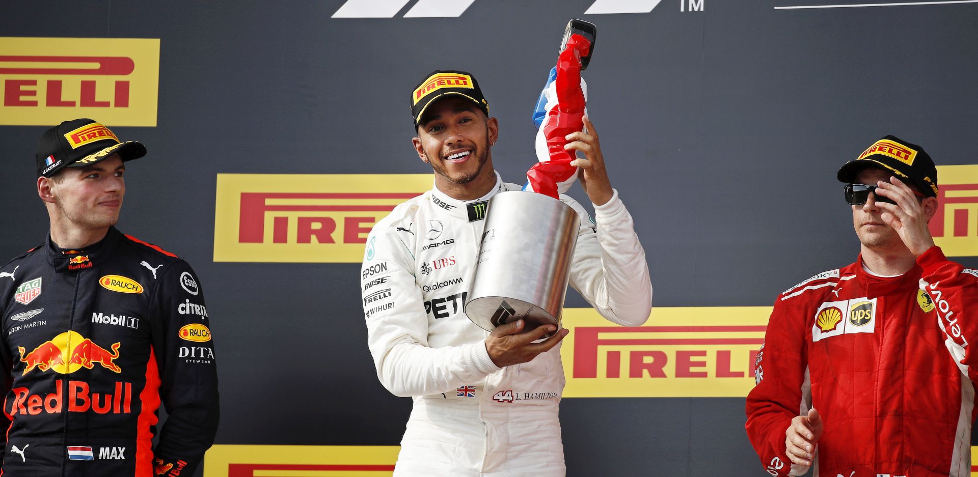 epa06836955 British Formula One driver Lewis Hamilton (C) of Mercedes AMG GP celebrates with his trophy on the podium after winning the 2018 French Formula One Grand Prix at Paul Ricard circuit in Le Castellet, France, 24 June 2018. Hamilton won ahead of second placed Dutch driver Max Verstappen (L) of Aston Martin Red Bull Racing and third placed Finnish driver Kimi Raikkonen (R) of Scuderia Ferrari.  EPA/YOAN VALAT