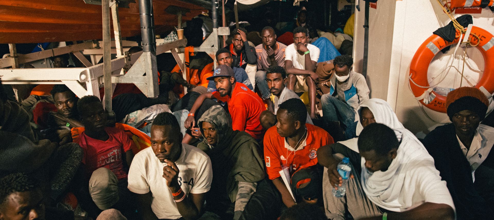 epa06838217 A handout photo made available by German NGO 'Mission Lifeline' on 25 June 2018 shows migrants aboard the NGO's rescue vessel 'Lifeline' in the Mediterranean, 25 June 2018. Members of the German parliament Bundestag on 25 June reported from their visit to the ship saying they witnessed a 'catastrophic' situation. Both Italy and Malta deny the ship an entry to one of their country's ports.  EPA/Felix Weiss / HANDOUT  HANDOUT EDITORIAL USE ONLY/NO SALES