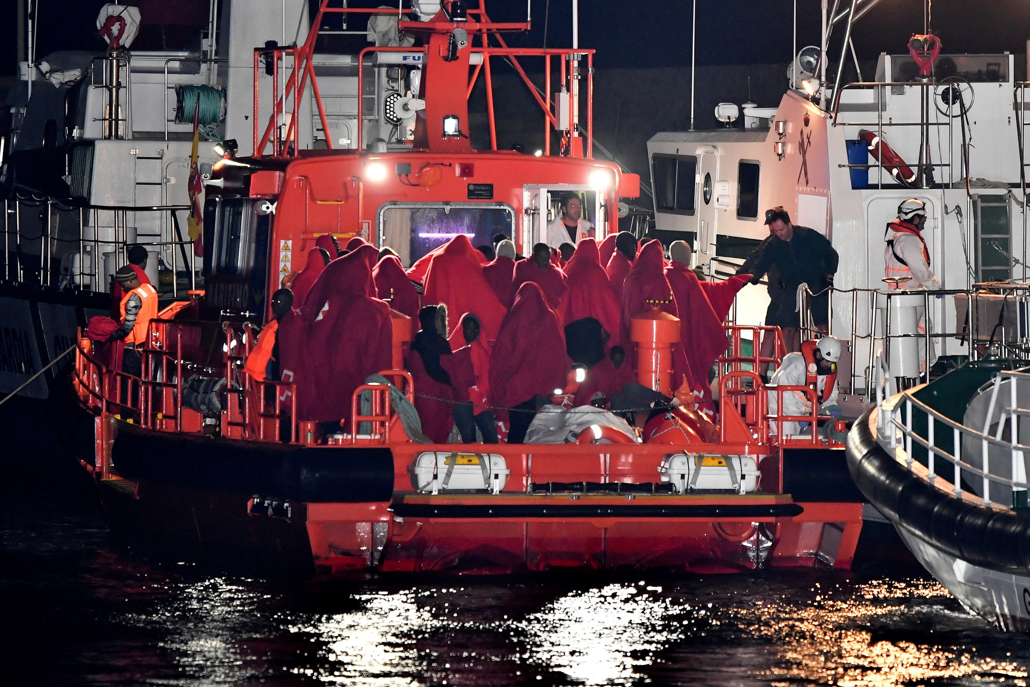 epa06798043 Spanish Sea Rescue ship with 51 migrants on board arrives in the port of Almeria, southern Spain, late 09 June 2018 (issued 10 June 2018). Migrants were rescued in Alboran Sea, off sourthern Spanish coast. Their boat was the sixth intercepted on 09 June, according to official sources.  EPA/CARLOS BARBA