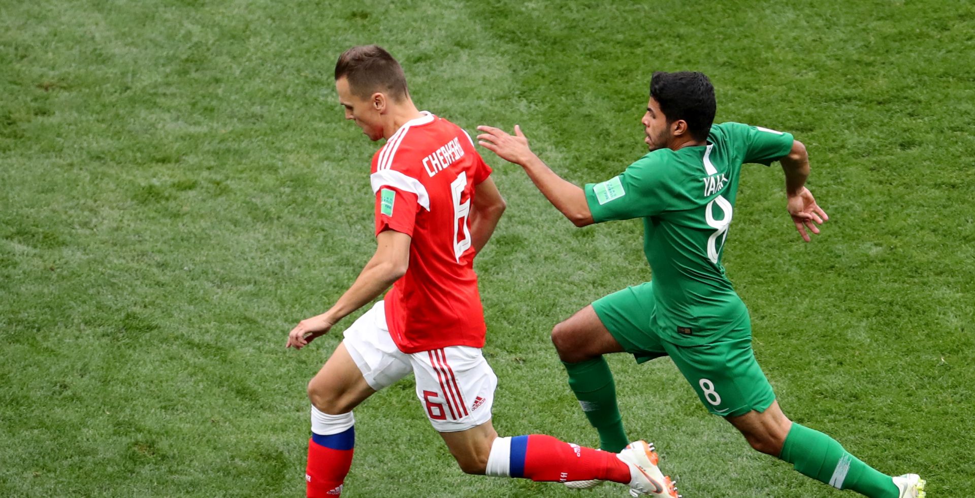 epa06807357 Denis Cheryshev (L) of Russia and Yahya Al-Shehri of Saudi Arabia in action during the FIFA World Cup 2018 group A preliminary round soccer match between Russia and Saudi Arabia in Moscow, Russia, 14 June 2018.

(RESTRICTIONS APPLY: Editorial Use Only, not used in association with any commercial entity - Images must not be used in any form of alert service or push service of any kind including via mobile alert services, downloads to mobile devices or MMS messaging - Images must appear as still images and must not emulate match action video footage - No alteration is made to, and no text or image is superimposed over, any published image which: (a) intentionally obscures or removes a sponsor identification image; or (b) adds or overlays the commercial identification of any third party which is not officially associated with the FIFA World Cup)  EPA/ABEDIN TAHERKENAREH   EDITORIAL USE ONLY