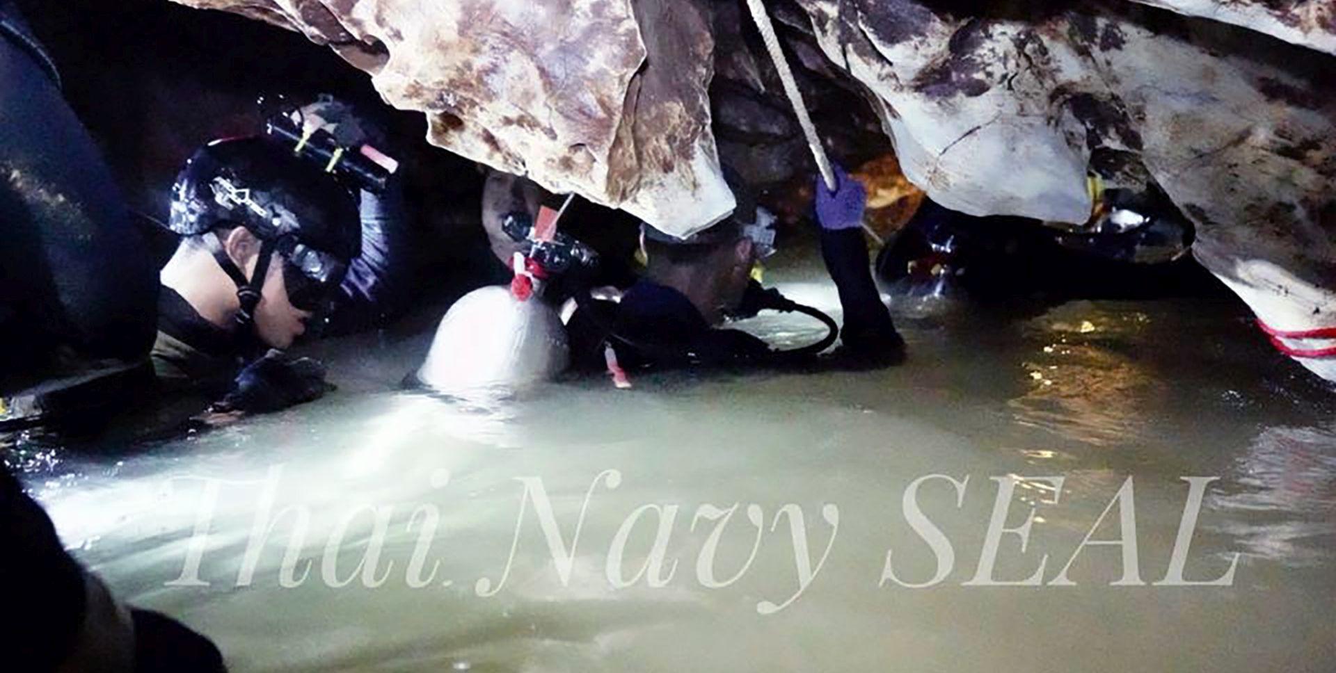epa06863734 A handout photo made available by Thai Navy Seal on 04 July 2018 shows Thai Navy officer and rescuers work inside a cave complex during the ongoing rescue operations for the child soccer team and their assistant coach, at Tham Luang cave in Khun Nam Nang Non Forest Park, Chiang Rai province, Thailand. Rescuers are bringing supplies and foods into the cave, where the missing 12 boys and their assistant coach remain, as efforts to drain the cave have not been successful due to rainy weather. Operations are underway to safely bring out the youth soccer team out of the cave. Thirteen of a youth soccer team including their assistant coach were trapped in Tham Luang cave since 23 June 2018.  EPA/THAI NAVY SEAL / HANDOUT ONLY WATERMARKED VERSION AVAILABLE HANDOUT EDITORIAL USE ONLY/NO SALES