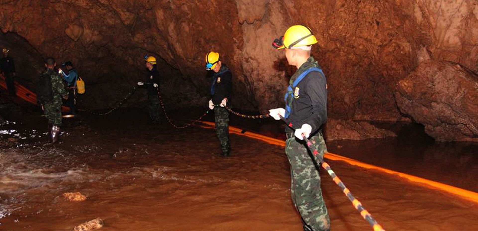 epa06866883 A handout photo made available by the Thai Navy SEAL on 06 July 2018 shows Thai military personnel carrying equipment inside a cave complex during the ongoing rescue operations for the youth soccer team and their assistant coach, at Tham Luang cave in Khun Nam Nang Non Forest Park, Chiang Rai province, Thailand. According to latest reports, a former Thai Navy diver has died during the rescue operations to safely bring out the youth soccer team out of the cave. Rescuers are bringing supplies and food into the cave, where the missing 12 boys and their coach remain trapped since 23 June, as efforts to drain the cave have not been successful due to rainy weather.  EPA/THAI NAVY SEAL HANDOUT  HANDOUT EDITORIAL USE ONLY/NO SALES