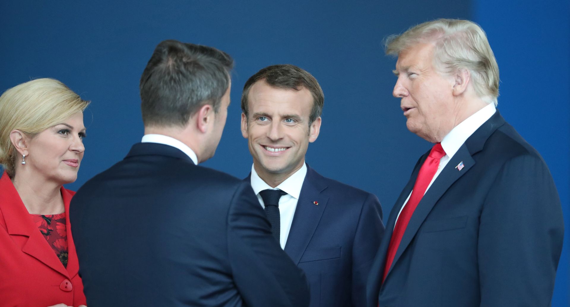 epa06880608 France's President Emmanuel Macron (2R) and US President Donald J. Trump (R) at NATO headquarters in Brussels, Belgium, 11 July 2018. NATO countries' heads of states and governments gather in Brussels for a two-day meeting. In picture at left is seen Croatian President Kolinda Grabar-Kitarovic.  EPA/TATYANA ZENKOVICH / POOL