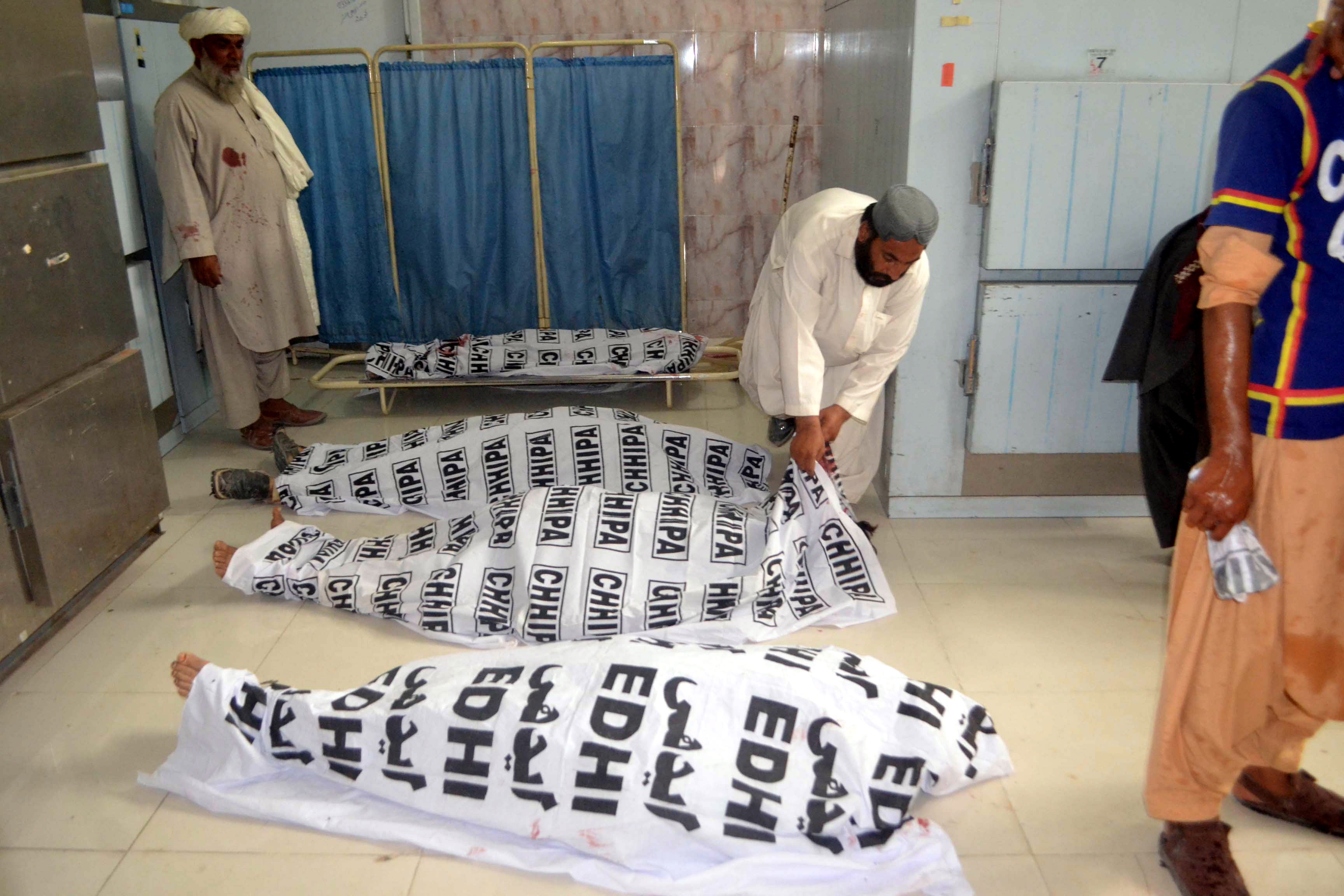 epa06885843 People shift bodies of the victims of a suicide bomb attack that targeted an election campaign rally of Balochistan Awami Party in Mastung, to a hospital in Quetta, Pakistan, 13 July 2018. At least 28 people including Siraj Raeesani, a BAP leader and party's candidate for General Elections, were killed in the incident. This is the third attack with casualties in ongoing campaigning for the general and provincial elections on Jul. 25, in which 105 million Pakistanis are expected to vote, according to the Election Commission of Pakistan.  EPA/JAMAL TARAQAI
