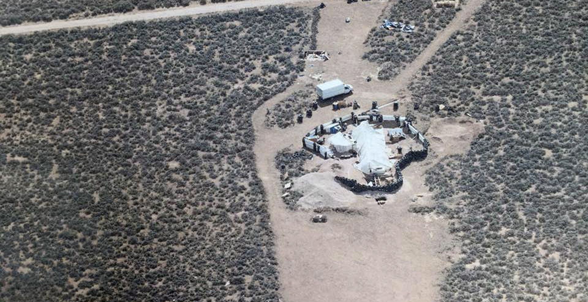 epa06929785 A handout photo made available by Taos County Sheriff’s Office shows an aerial photo of compound in rural Amalia, New Mexico, USA  (issued 05 August 2018). Law enforcement officers found 11 children, aged 1 to 15 living in squalid conditions and with little food at a compound in the rural community of Amalia, New Mexico, USA. Two men, Siraj Wahhaj and Lucas Morten were taken into custody.  EPA/TAOS COUNTY SHERIFF'S OFFICE  HANDOUT BEST QUALITY AVAILABLE HANDOUT EDITORIAL USE ONLY/NO SALES
