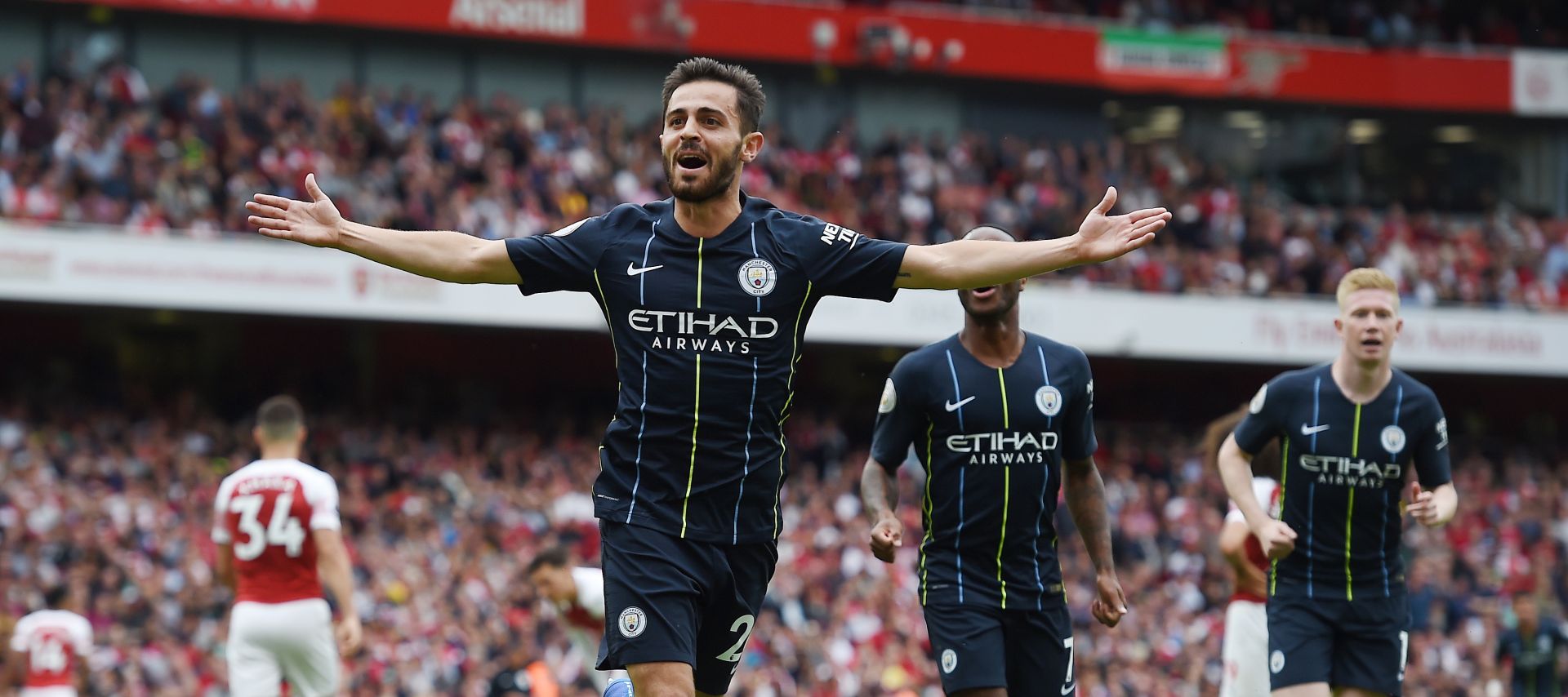 epa06946114 Manchester City's Bernardo Silva celebrates after scoring during the English Premier League soccer match between Arsenal FC and Manchester City at the Emirates Stadium in London, Britain, 12 August 2018.  EPA/ANDY RAIN EDITORIAL USE ONLY. No use with unauthorized audio, video, data, fixture lists, club/league logos or 'live' services. Online in-match use limited to 75 images, no video emulation. No use in betting, games or single club/league/player publications.