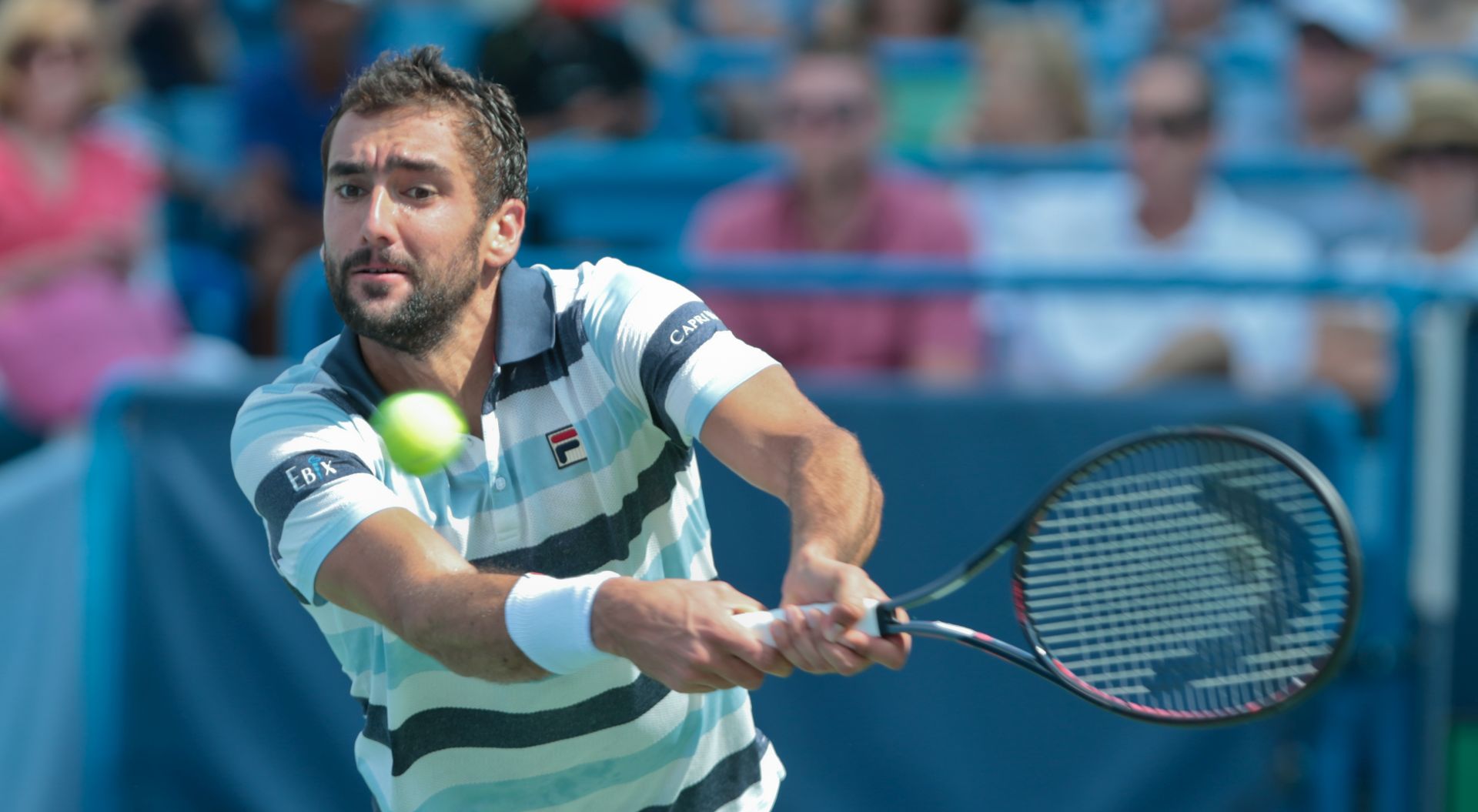 epa06957332 Marin Cilic of Croatia in action against Novak Djokovic of Serbia in their semi-final match in the Western & Southern Open tennis tournament at the Lindner Family Tennis Center in Mason, Ohio, USA, 18 August 2018.  EPA/MARK LYONS