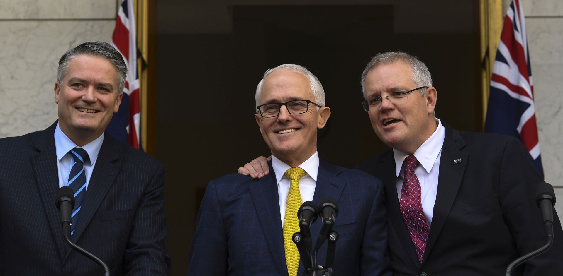epa06963460 Australian Prime Minister Malcolm Turnbull (C), Australian Finance Minister Mathias Cormann (L) and Australian Federal Treasurer Scott Morrison (R) speak to the media during a press conference at Parliament House in Canberra, Australia, 22 August 2018. According to media reports, Prime Minister Turnbull expressed that he will no longer pursuit corporate tax cuts in the next federal elections, scheduled to take place on or before 02 November 2019.  EPA/LUKAS COCH  AUSTRALIA AND NEW ZEALAND OUT