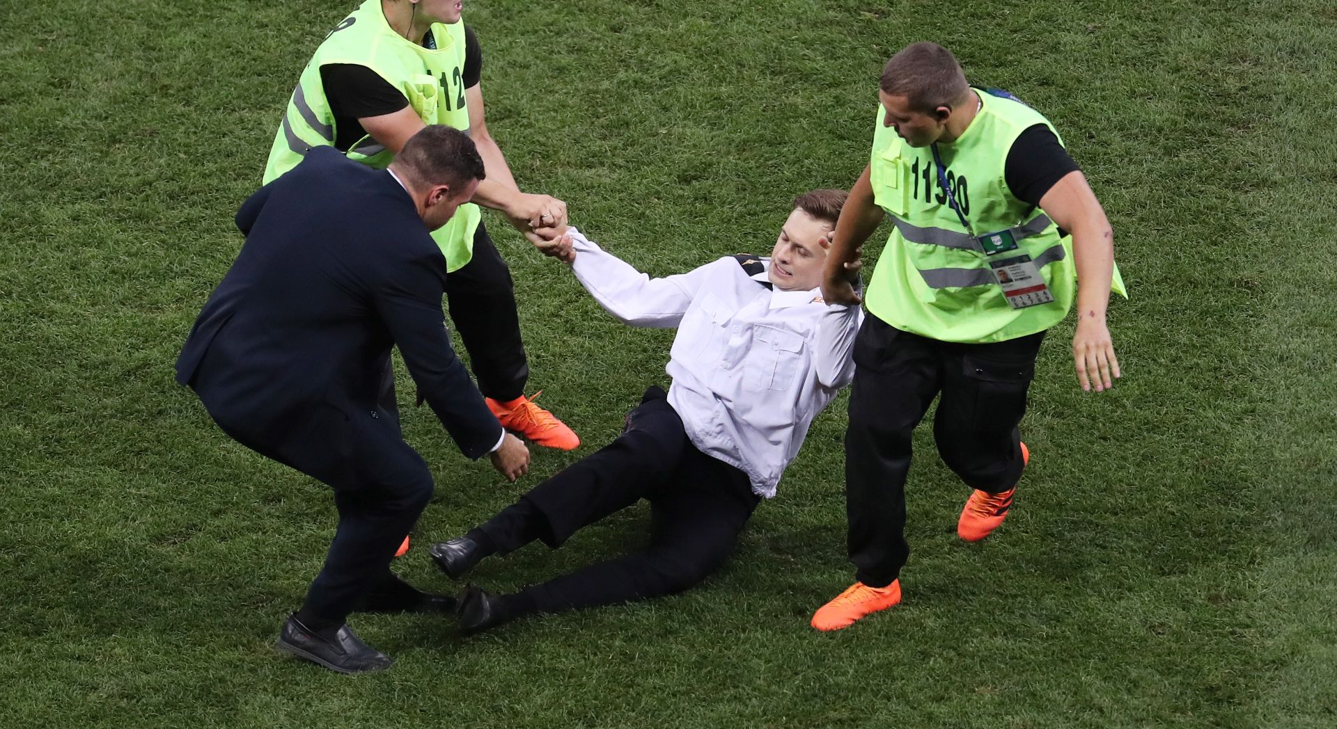 epa07016928 (FILE) - A pitch invader Pyotr Verzilov (C) of Pussy Riot is removed from the pitch during the FIFA World Cup 2018 final between France and Croatia in Moscow, Russia, 15 July 2018  (reissued on 13 September 2018). According to media reports on 13 September 2018, Pyotr Verzilov fell ill after attending a court hearing for Veronika Nikulshina, a fellow Pussy Riot member, he has been hospitalised late on September 11 in Moscow, where he remains in a critical condition. Verzilov is currently receiving treatment at the toxicology wing of Moscow's Bakhrushin City Clinical Hospital.  EPA/ABEDIN TAHERKENAREH   EDITORIAL USE ONLY  EDITORIAL USE ONLY *** Local Caption *** 54494130