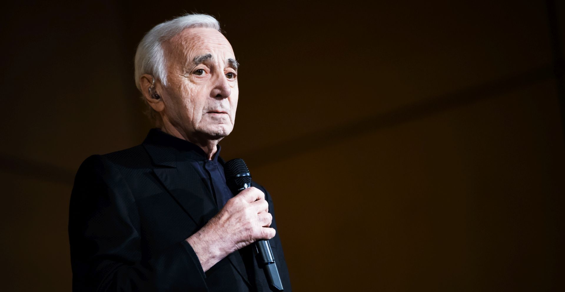 epa07061348 (FILE) - Armenian-born French singer Charles Aznavour performs during the Grand Concert de la Francophonie held in honor of Armenia, upcoming host country of the 17th Francophone Summit of the International Organization of French speakers, at the European headquarters of the United Nations in Geneva, Switzerland, 13 March 2018 (reissued 01 October 2018). According to reports Armenian-born French singer Charles Aznavour has died aged 94 on 01 October 2018.  EPA/VALENTIN FLAURAUD
